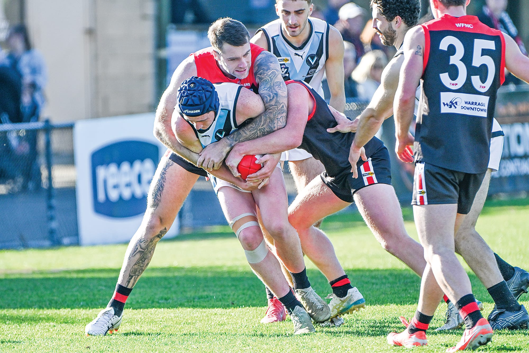 Power’s Jayden Burns is tackled by Warragul’s Brayden Fowler and Rory Nettle. Photo: The Warragul & Drouin Gazette.