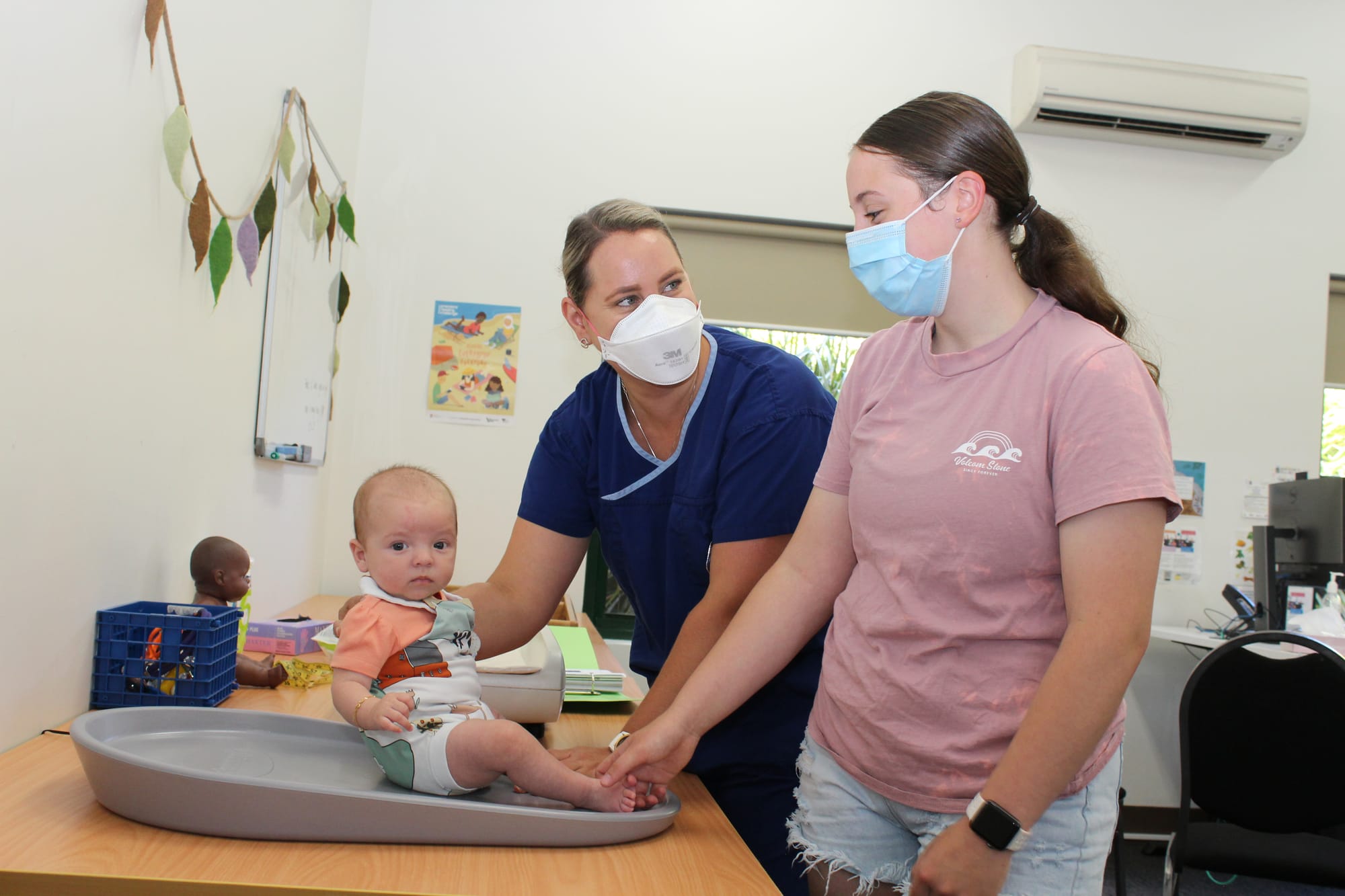 Maternal and Child Health Nurse Hayley Blundell checks in with Cloe Booth and her baby Isabella Peters.