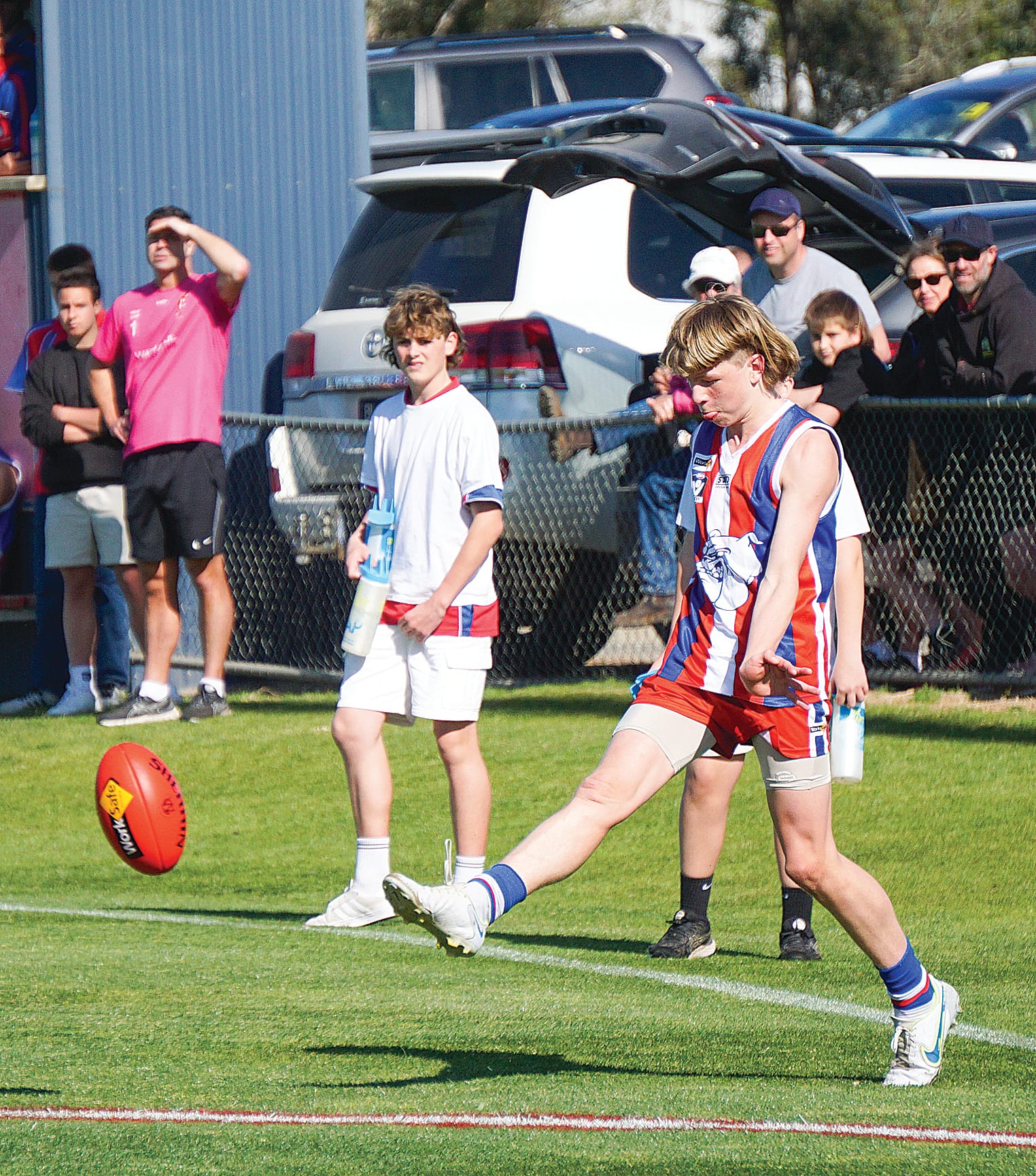 Bailey Hennessy launches from the sideline. Ns043823