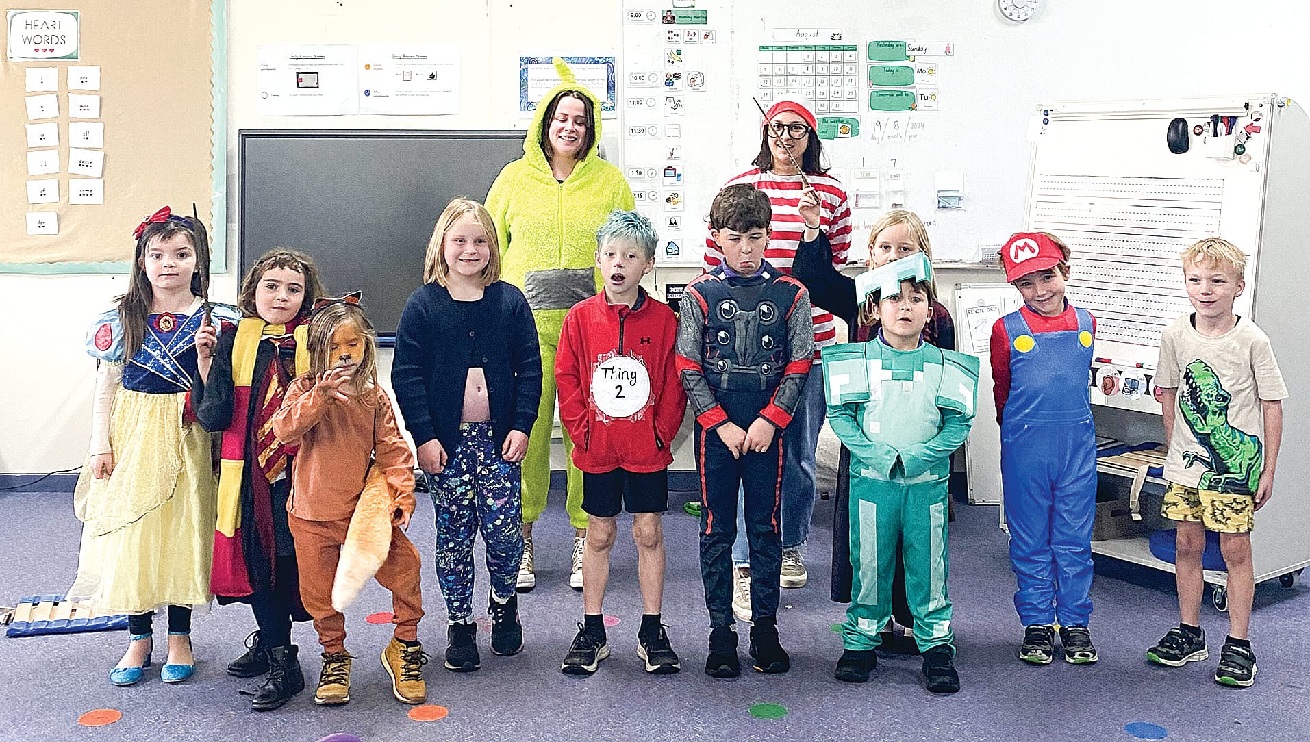 Teachers encourage a love of reading with prep and grade one students during Book Week at Powlett River Primary School. 