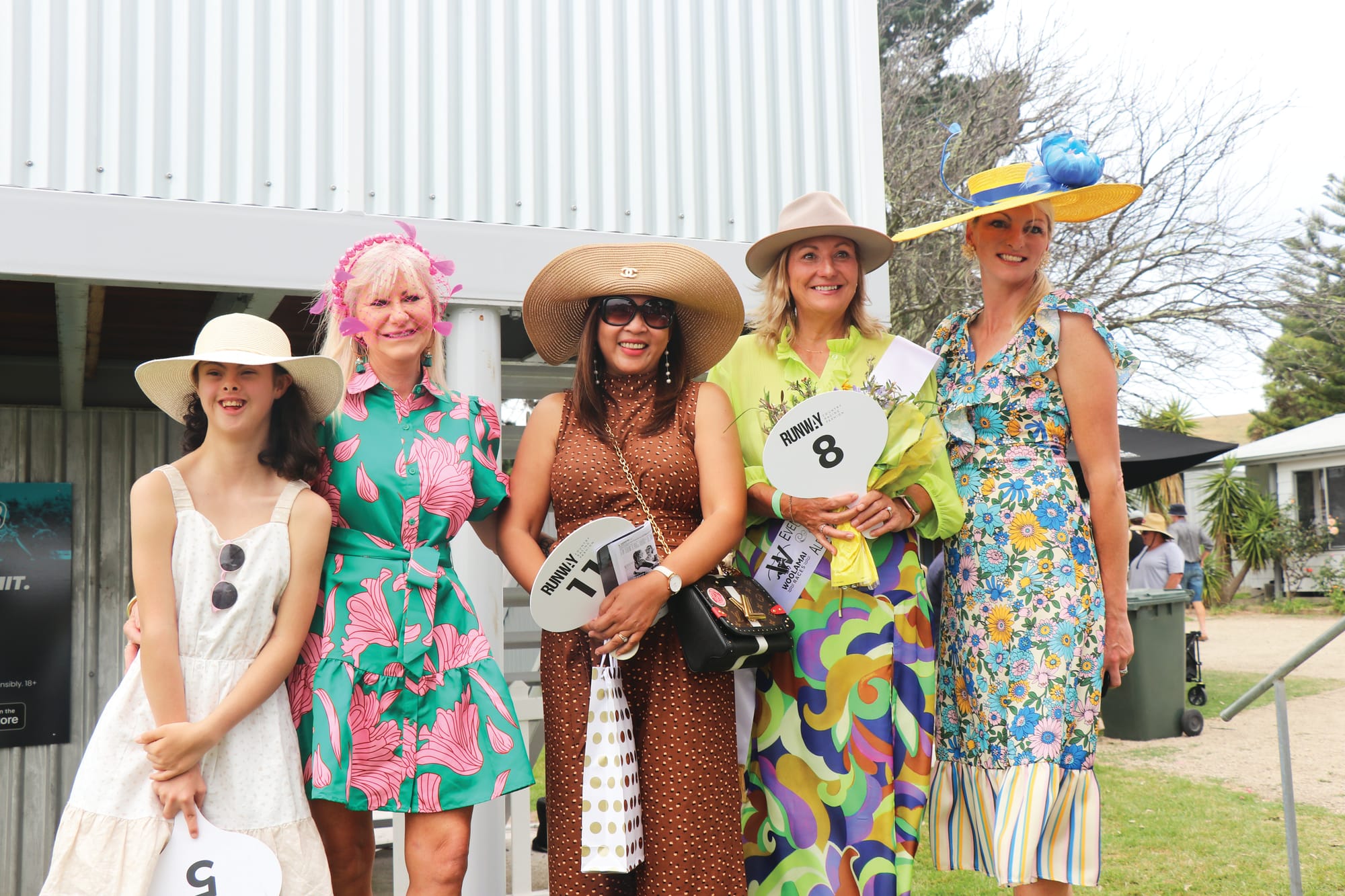 Sarah Delosa, Mandy Manning, Arlene Dean, Angela Merton and Karlie Owen representing fashions on the field for the 2023 Woolamai races. Z30_0523