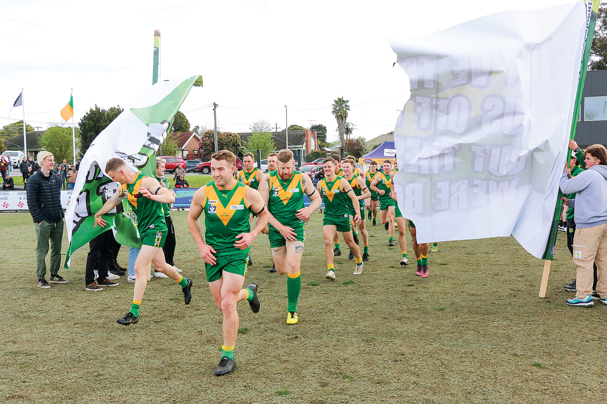 Tom Marriott leads the Leongatha Parrots out for their date with destiny in the Gippsland League grand final.