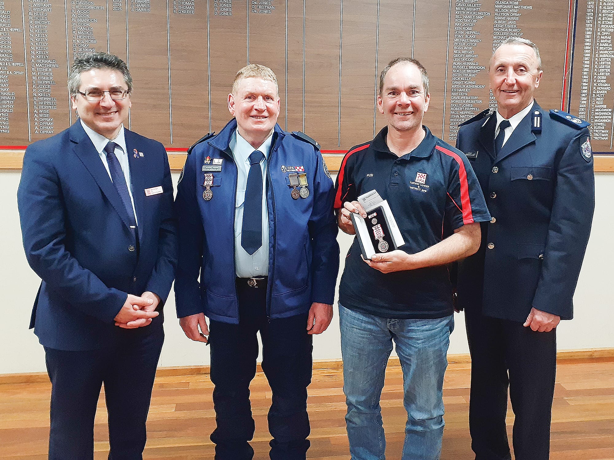Tarwin Lower and District Member Ron Taylor was presented with his service medal by CFO Sam Costanzo, Captain Mick Moore, and Commander Andrew McCartney.