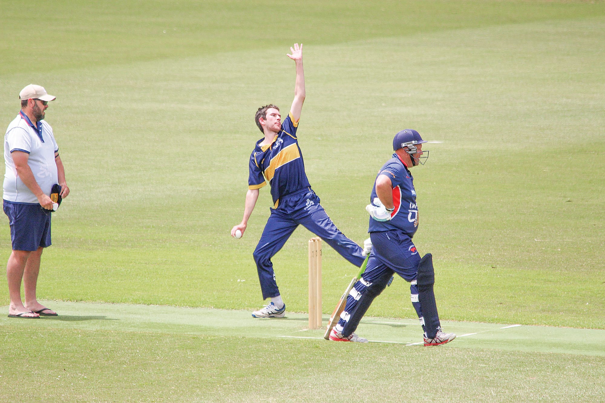 Cougars quick Josh Thomas looks to deliver the ball for the visitors in their six-wicket win.
