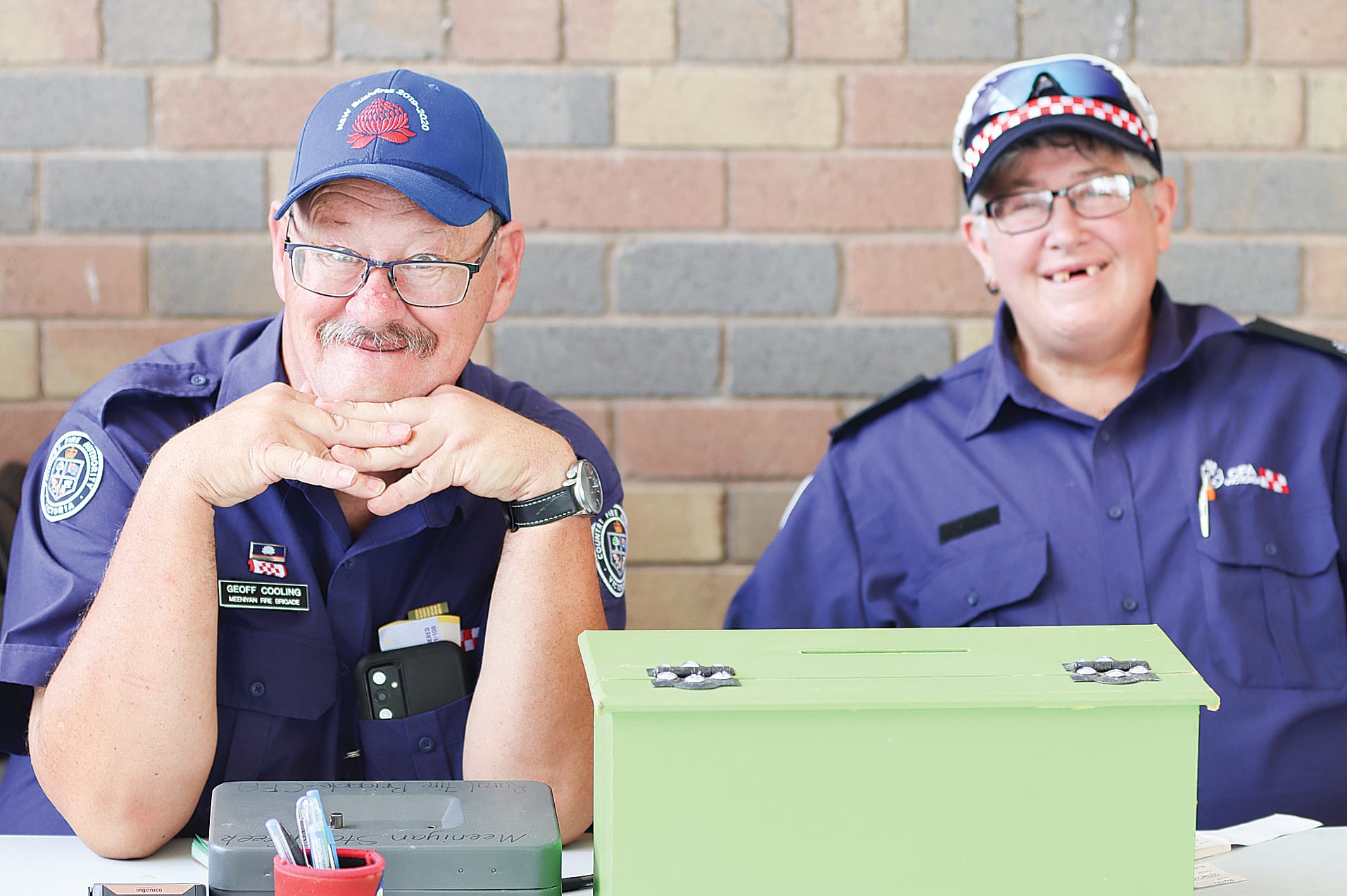 Members of the Meeniyan Fire Brigade, Geoff Cooling and Sean Carson selling raffle tickets. W32_1025