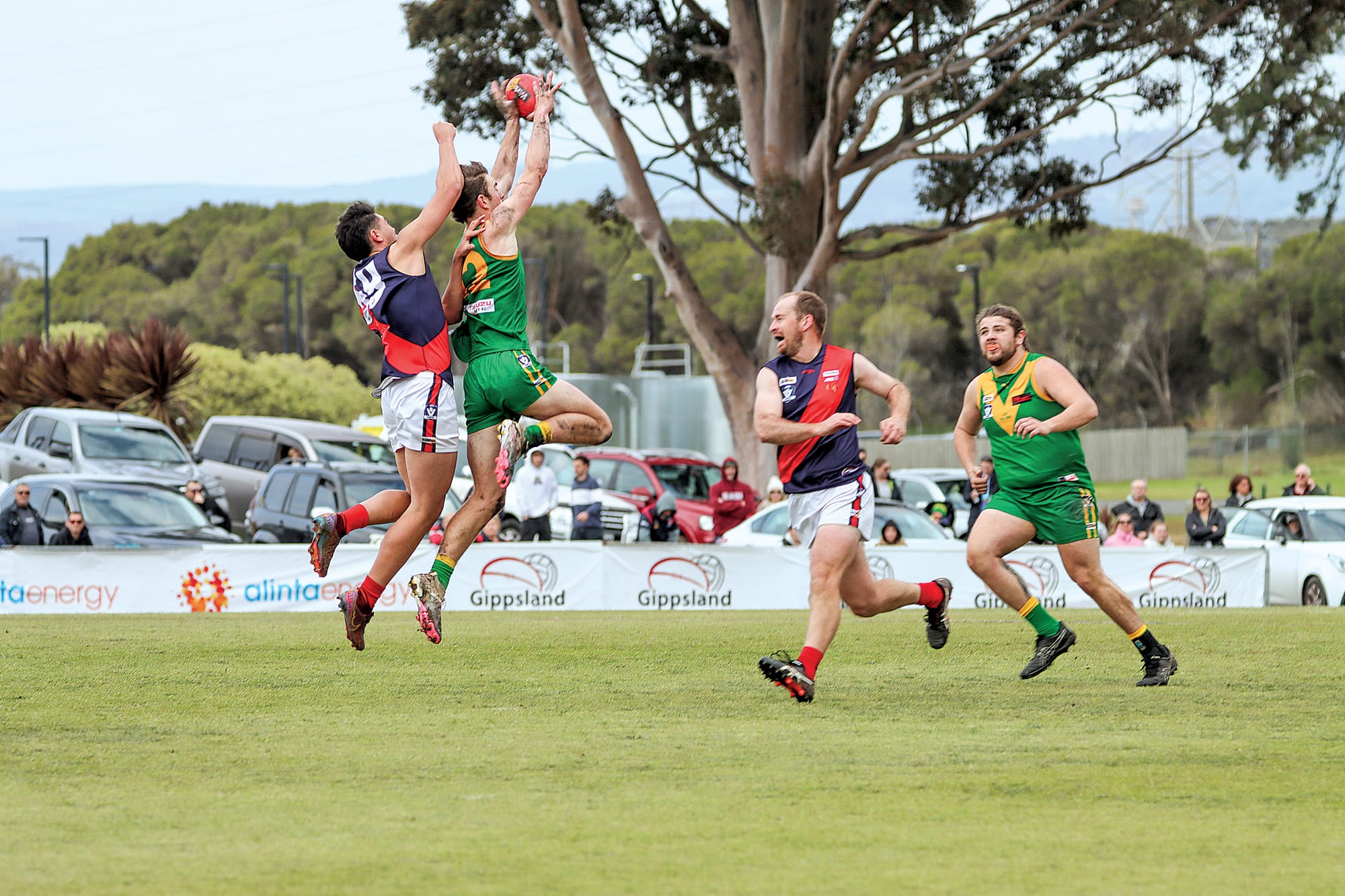 Leongatha’s Trent McRae flies against Tyson Matthews of Bairnsdale. A48_3924