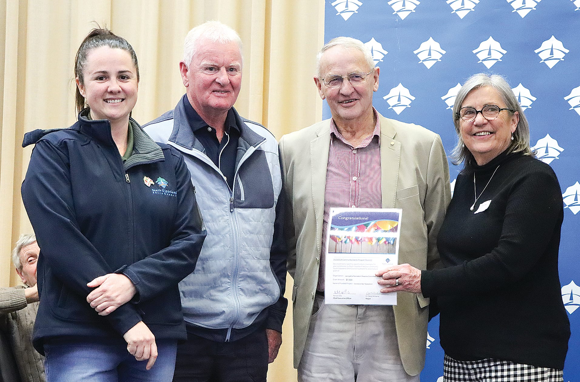 Graeme Winkler and Glenn Wright of the Leongatha Recreation Reserve Committee of Management are pleased with $7500 to assist with the cost of grandstand stair replacement, with Mayor Clare Williams and Cr Mohya Davies. A14_3124