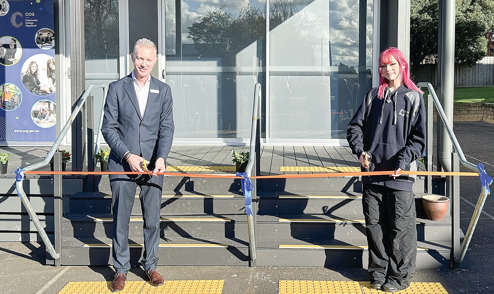 Dale Gemmel (CEO of CCG) and CCG student Tayah Souter cut the ribbon to officially open four new classroom at the Leongatha campus. ob03_2724