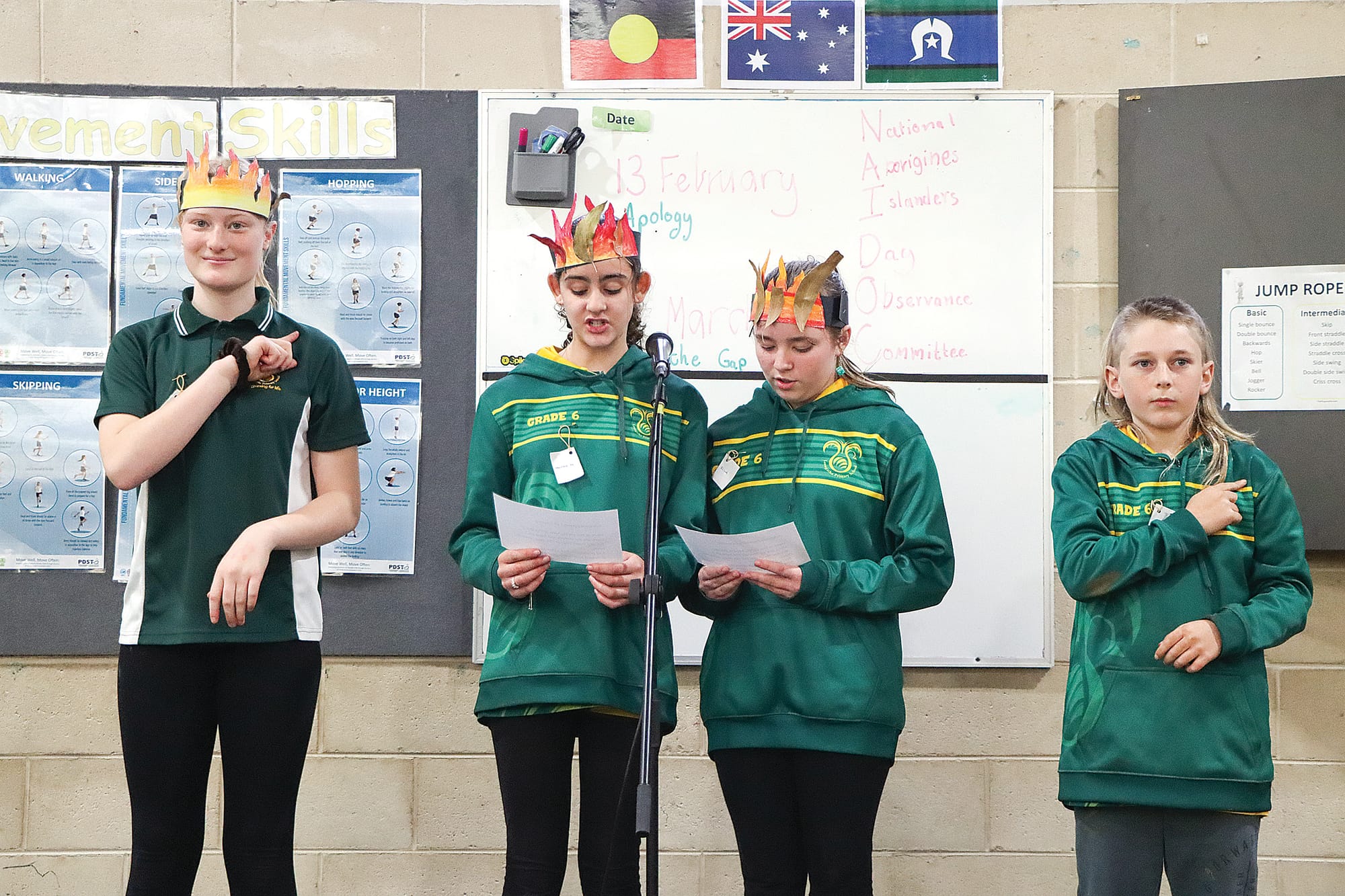 Annabelle, Hannah, Elina and Matthew present the acknowledgement, with music captains Hannah and Elina speaking and language captains Annabelle and Matthew signing in Auslan. A13_3024