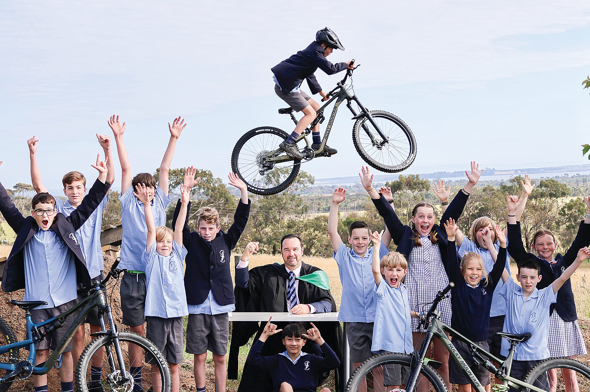 Principal of Newhaven College Tony Corr joins members of the college’s mountain bike team in celebrating the launching of a new MTB Academy at the school this week.