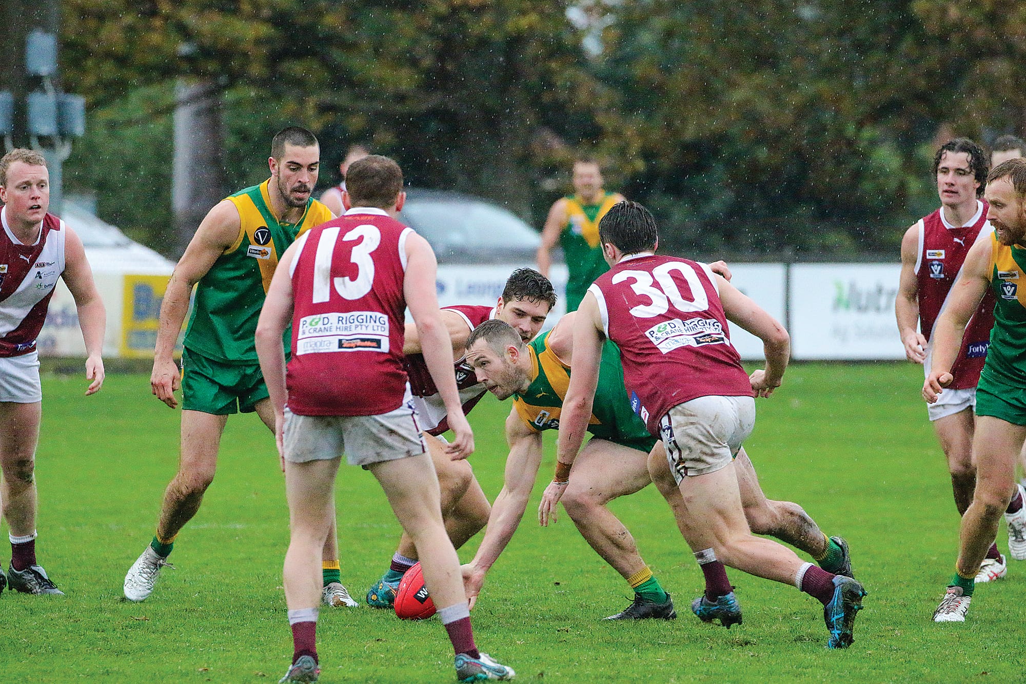 Leongatha’s Tom Marriott gets hands to the ball, protecting it from a Traralgon pack. tkFootyLeongatha04_2923