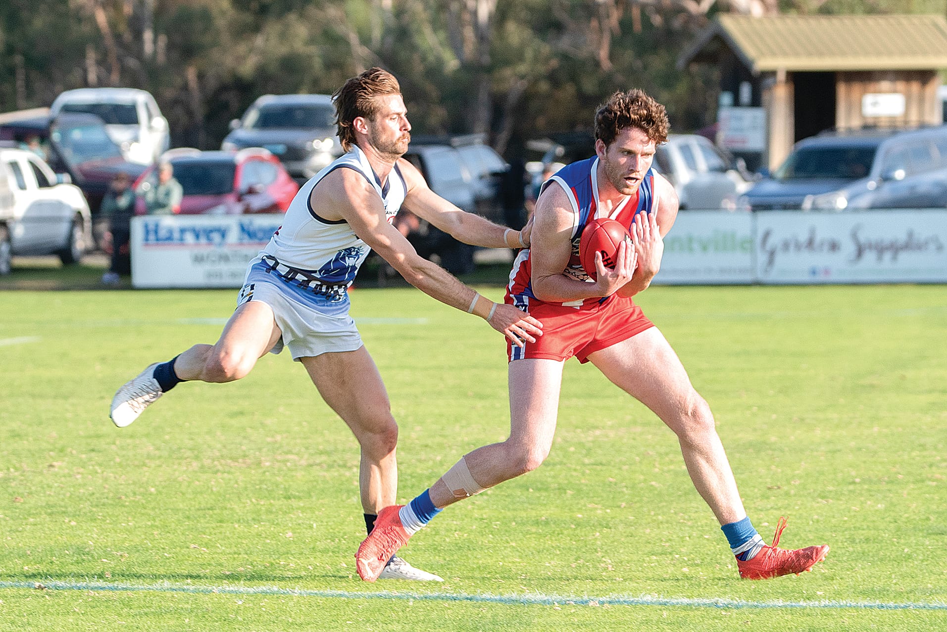 Phillip Island’s Jordy Patullo marks in front of Kilcunda-Bass’ Cam McKenzie.