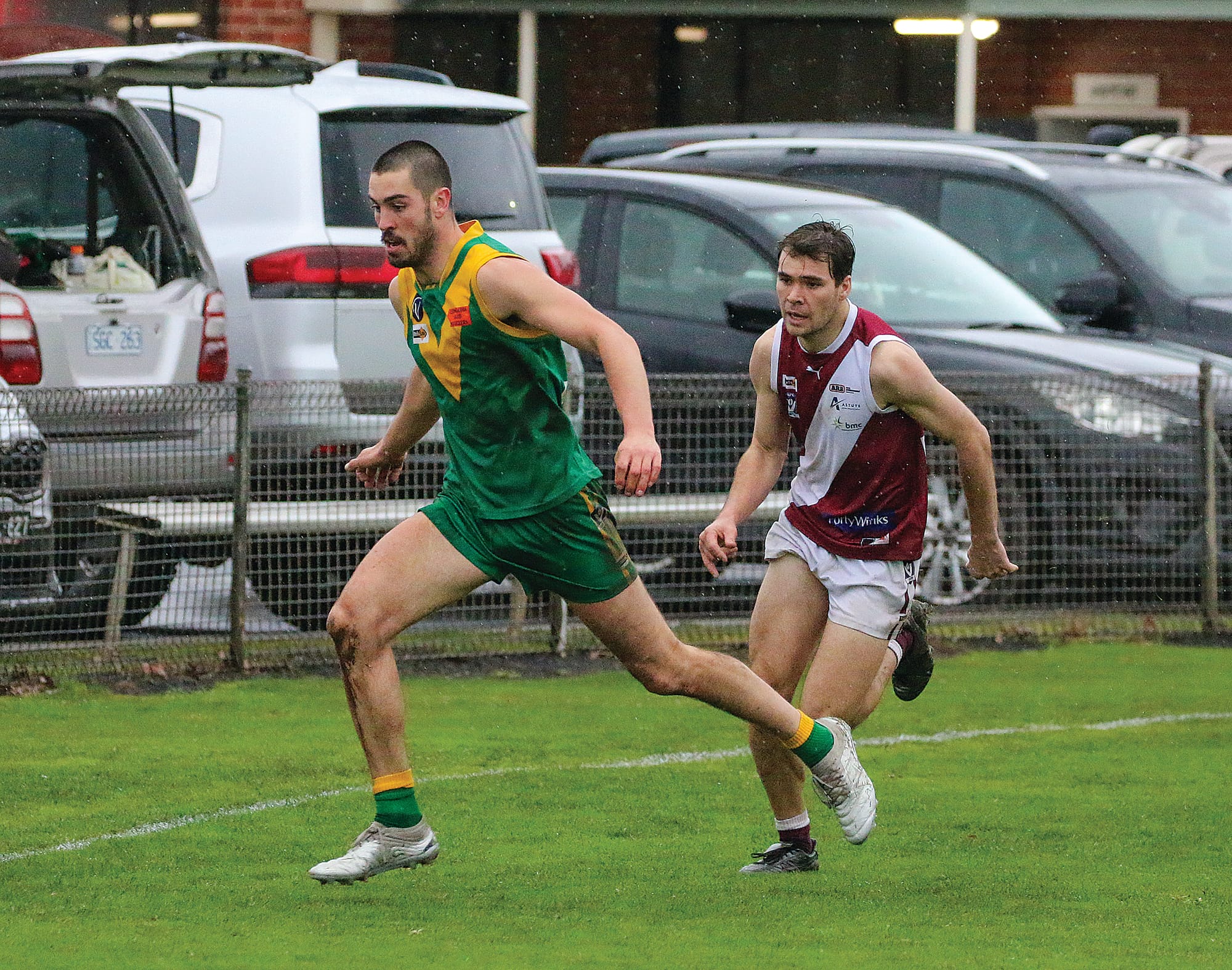 Noah Gown chases down the ball, pursued by his Traralgon opponent. tkFootyLeongatha03_2923