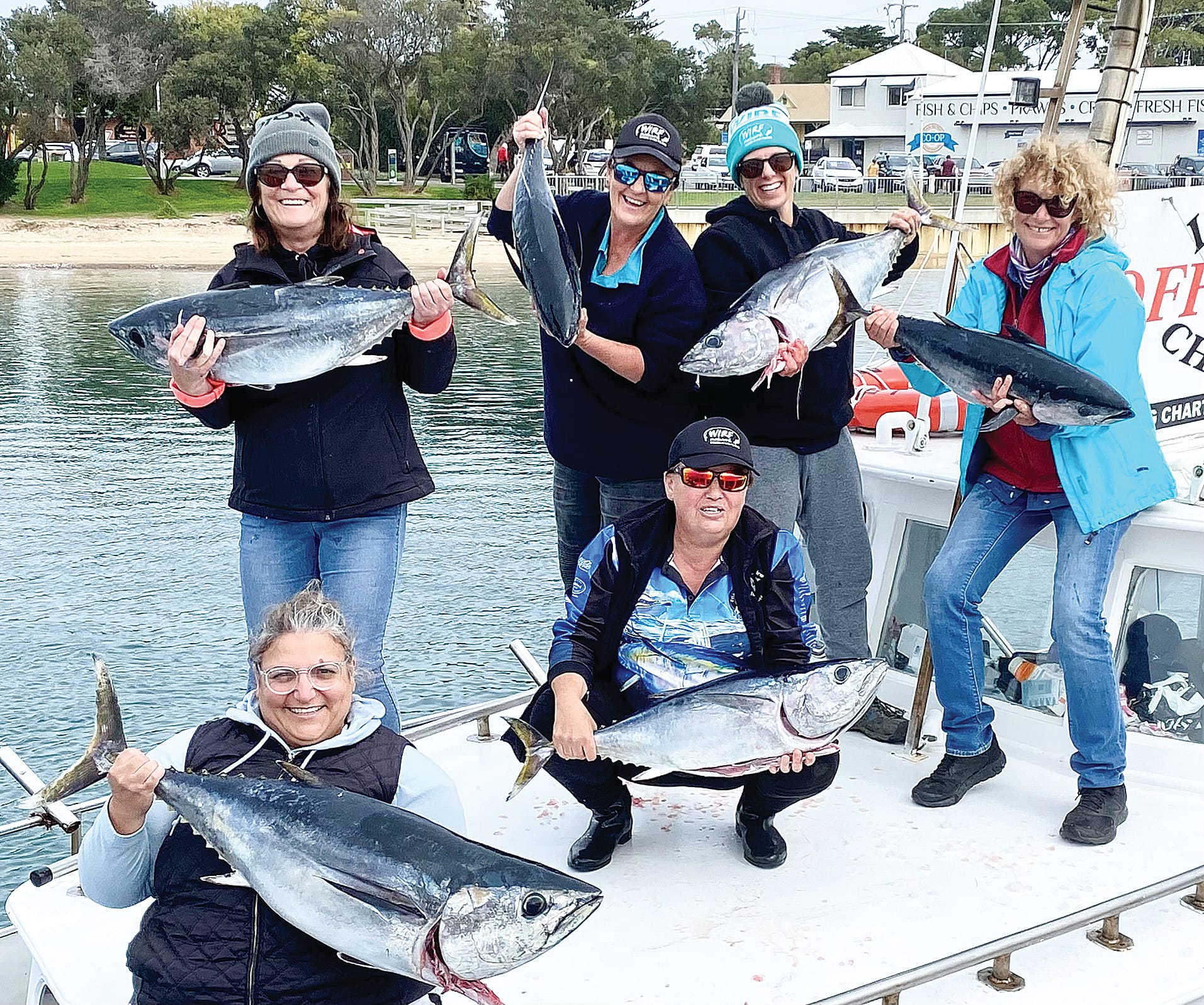 The ladies proudly showing off their catch of southern bluefin tuna.
