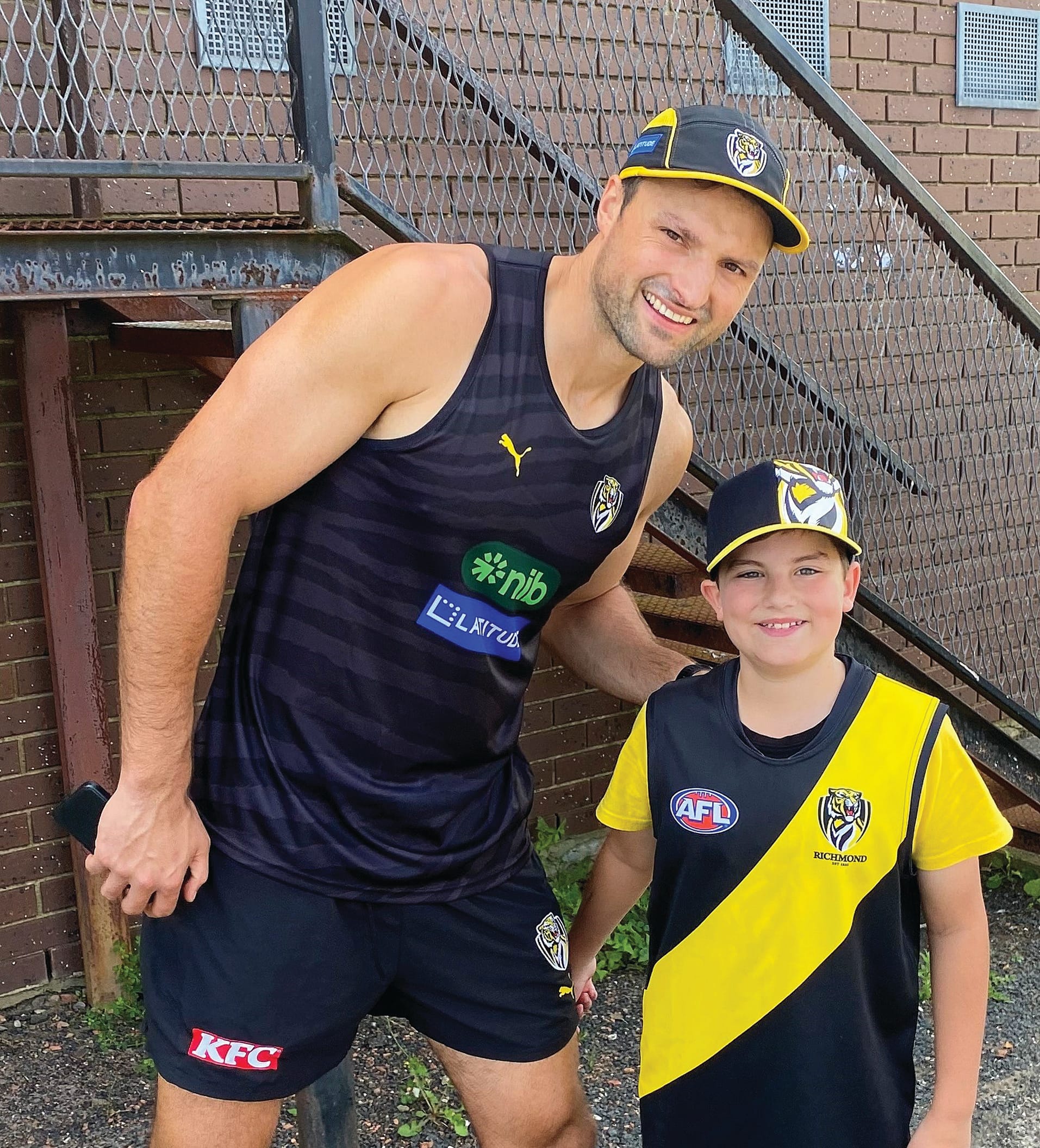 Richmond co-captain Toby Nankervis meets with young fan Max Gammaldi during training at Wonthaggi.