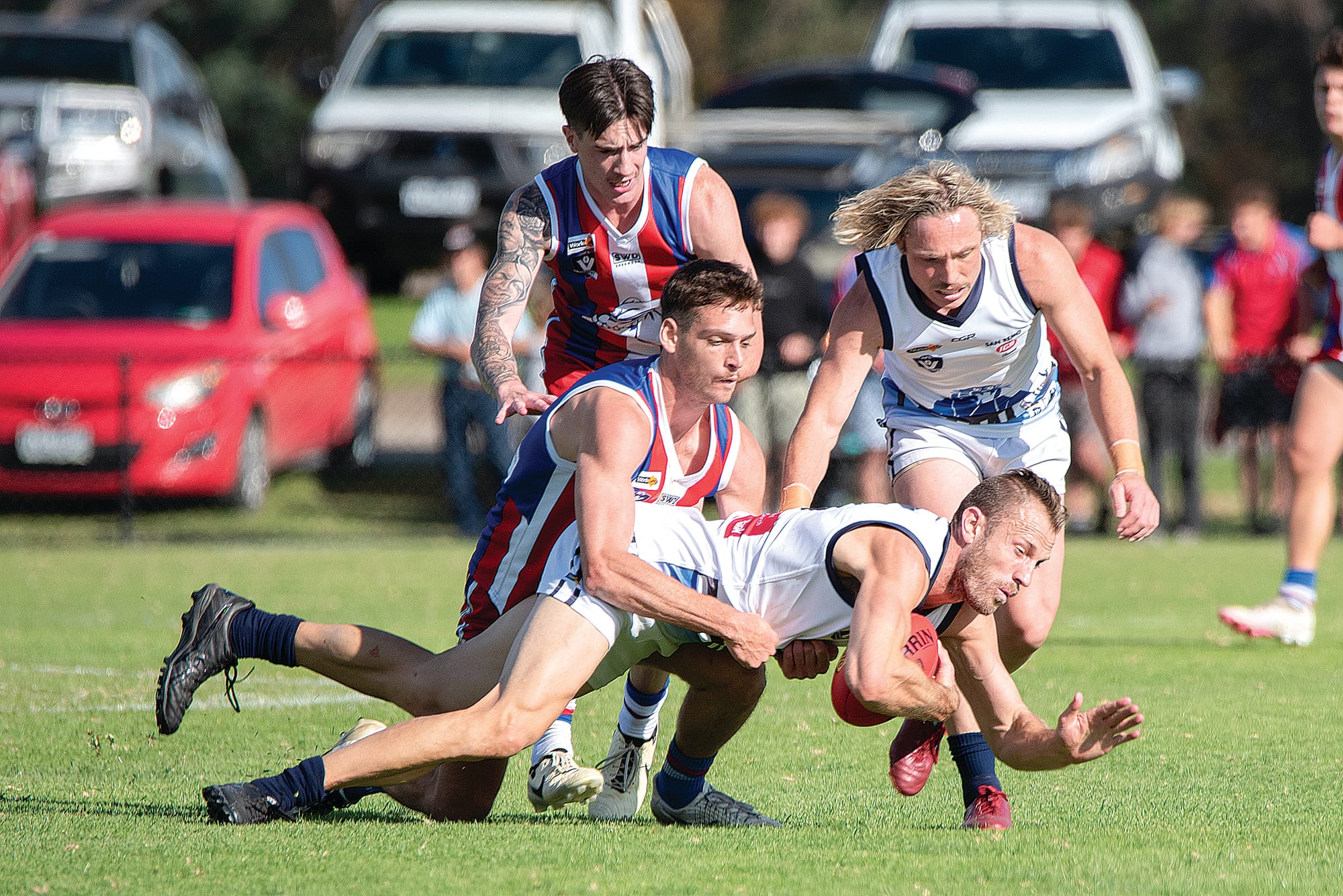 At ground level Kilcunda-Bass’ Travis Tuck tries to gain possession.