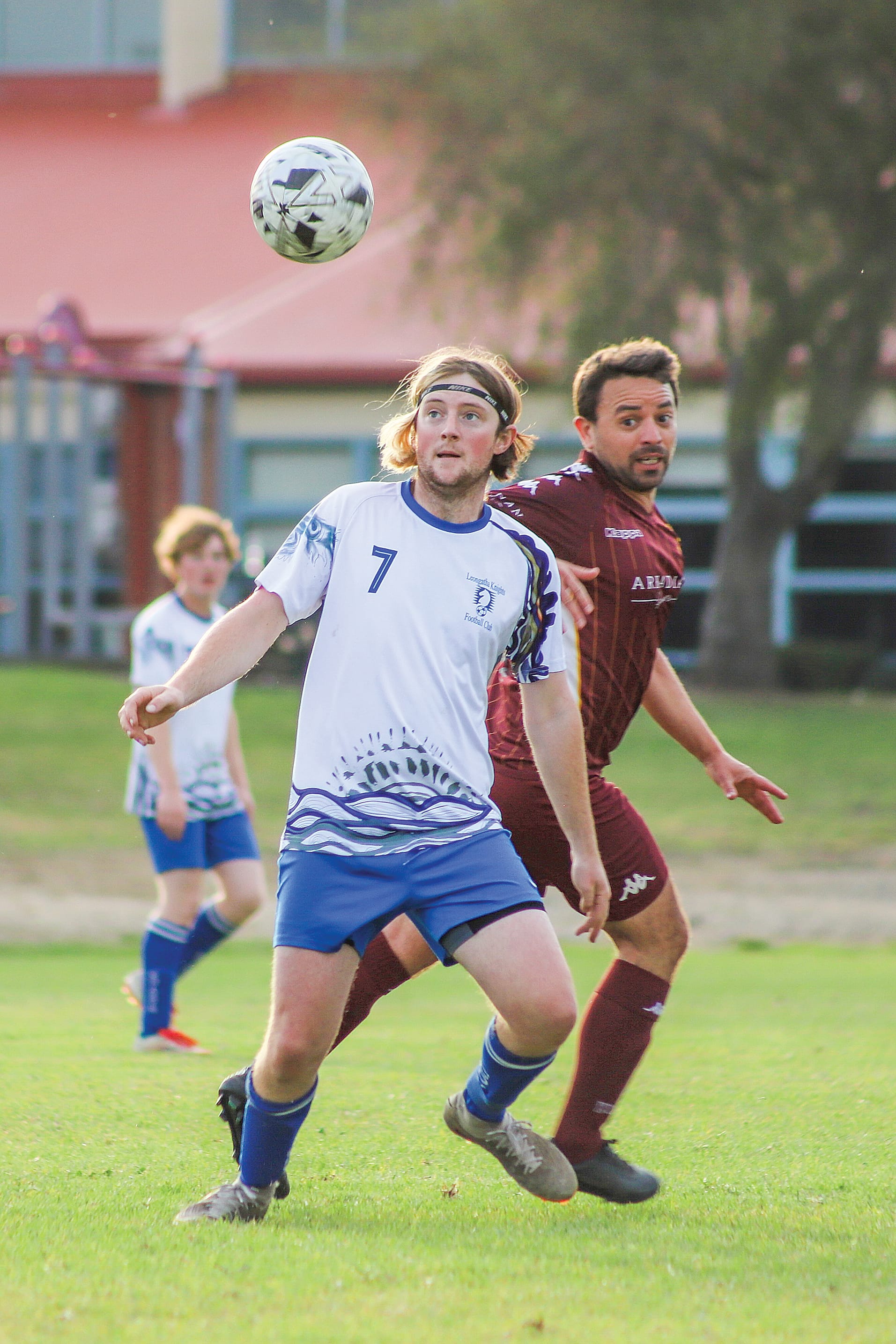 LKFC’s left back Jack Bainbridge eyes the dropping ball. 