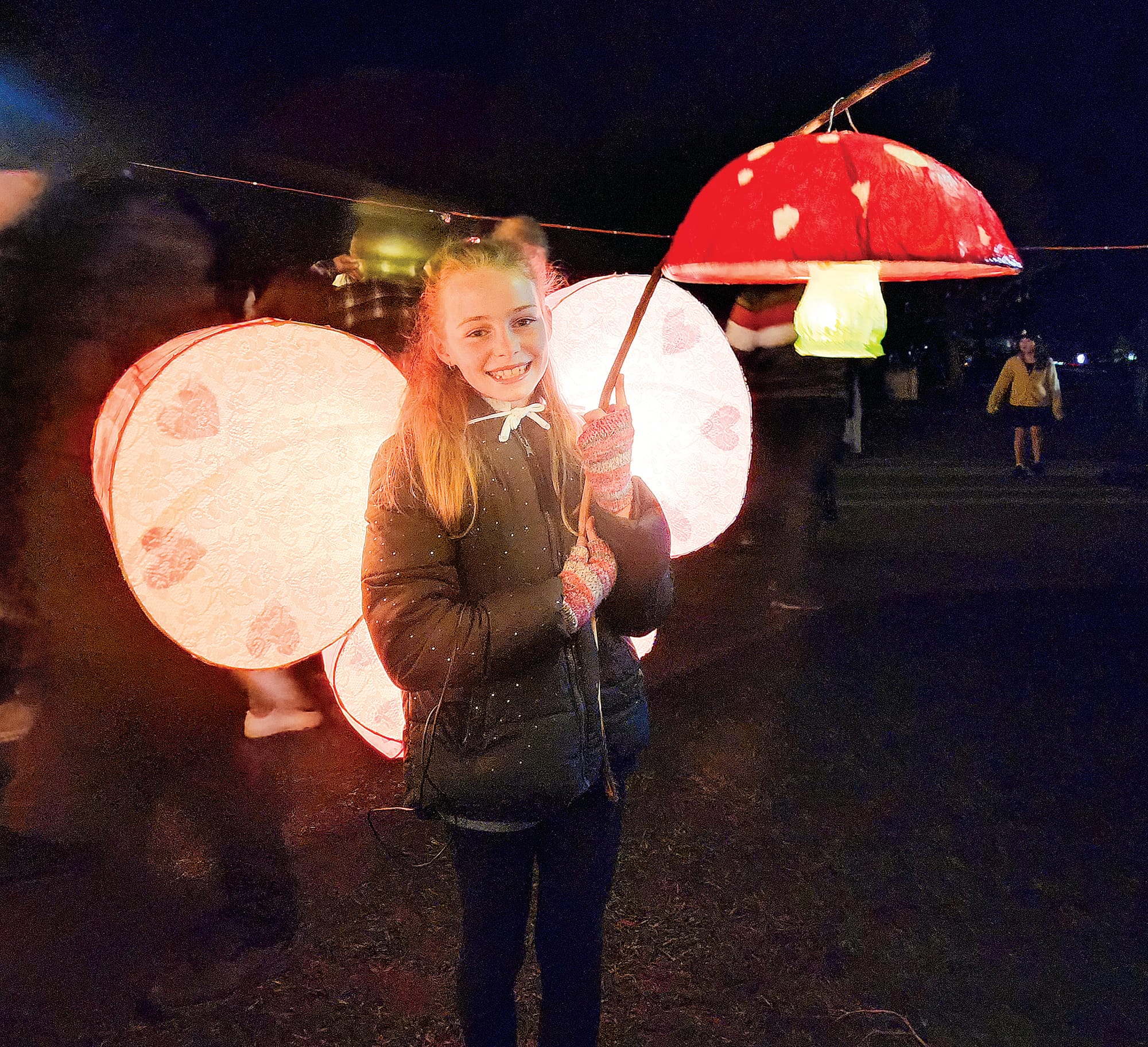 The glow of lanterns lined the main road as young and old alike took part. C56_3122