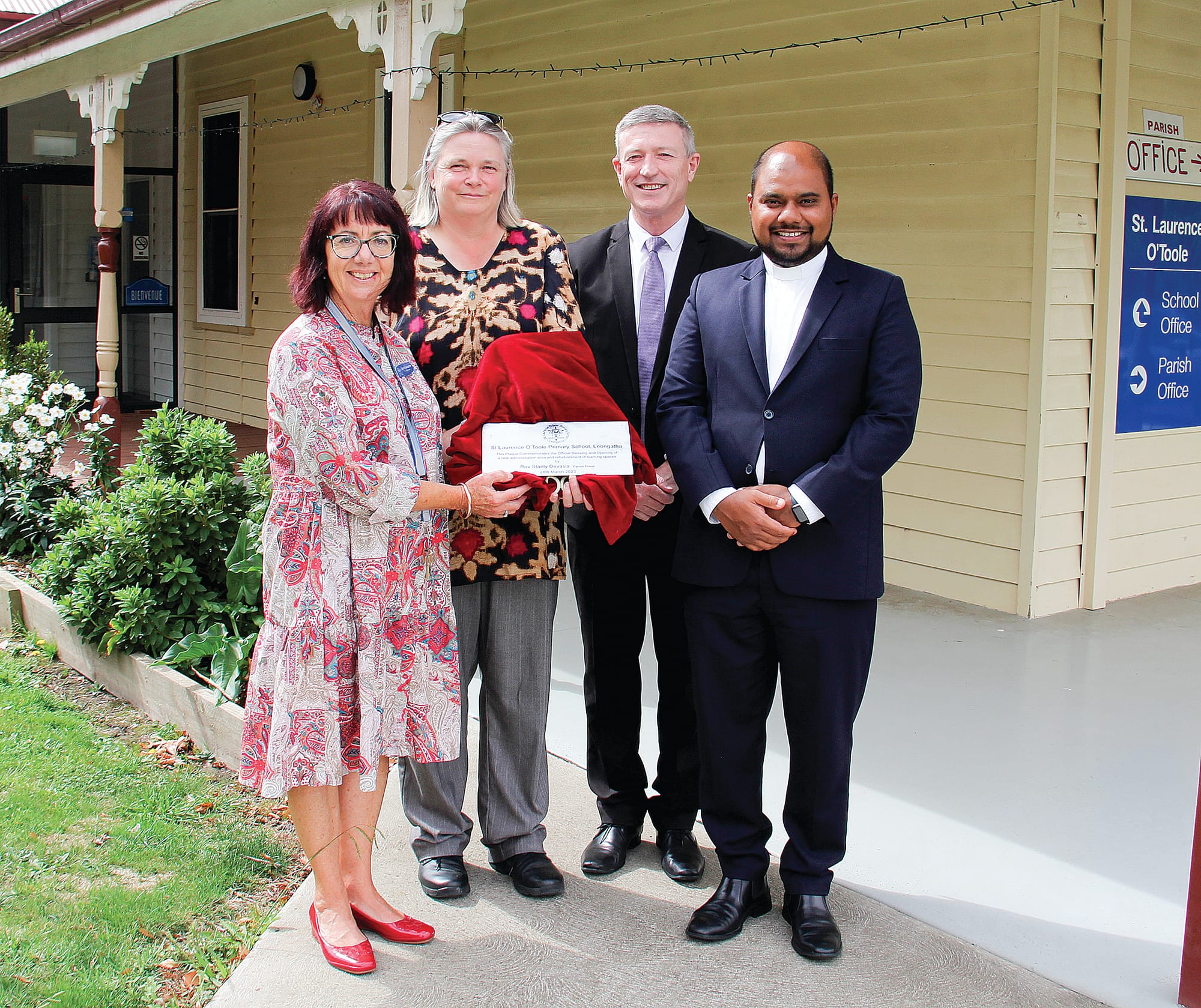 Plaques were unveiled to commemorate the blessing and opening of refurbished classrooms and new staff and student amenities at St Laurence O’Toole Primary School, Leongatha last week. From left: Current Principal Elizabeth O’Loughlin, Previous Principal Ms Kate Dourley, Director of Catholic Education in the Diocese of Sale, Mr Paul Velten and Parish Priest Father Stanly Devesia.