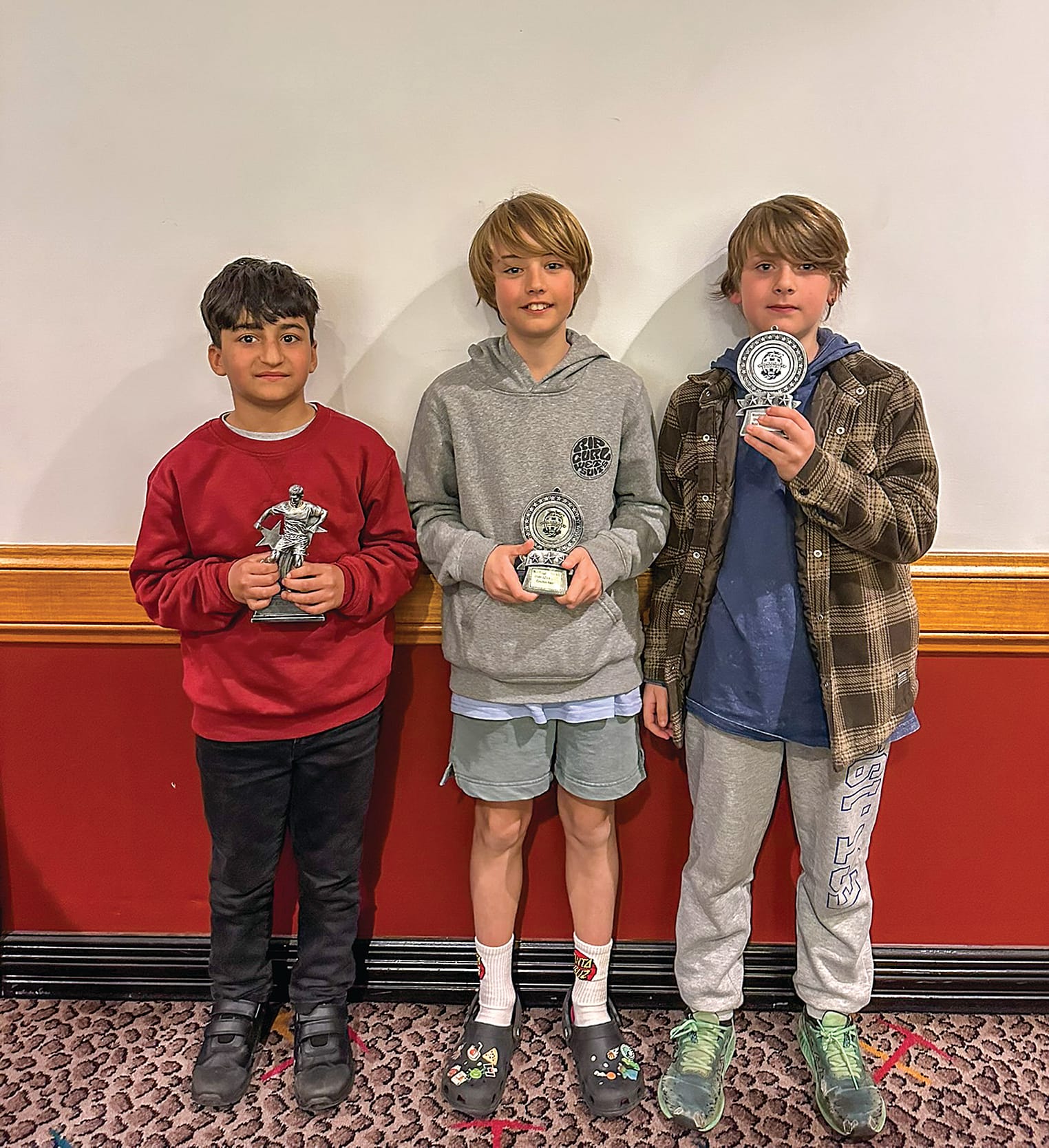 Under 12B: Marwan Darwesh (MVP), Fraser Johnson (Coach’s Award), and Rory Barta (Most Improved) proudly received awards for their efforts in the U12B team.