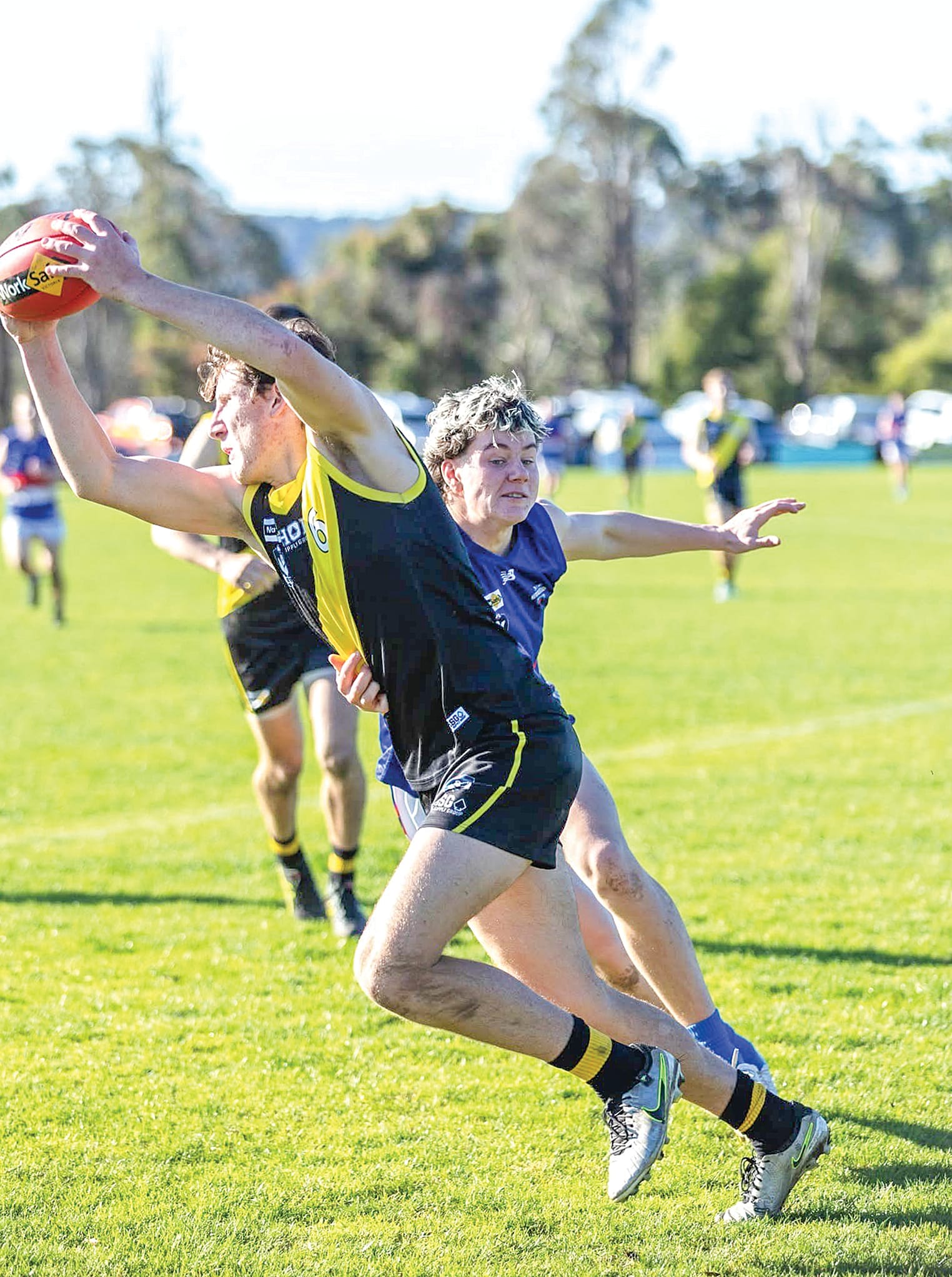Archie Woodall beats his Newborough opponent to the footy during Mirboo North’s commanding win on Saturday, being one of the Tigers’ best. Photo: Annie Holland.
