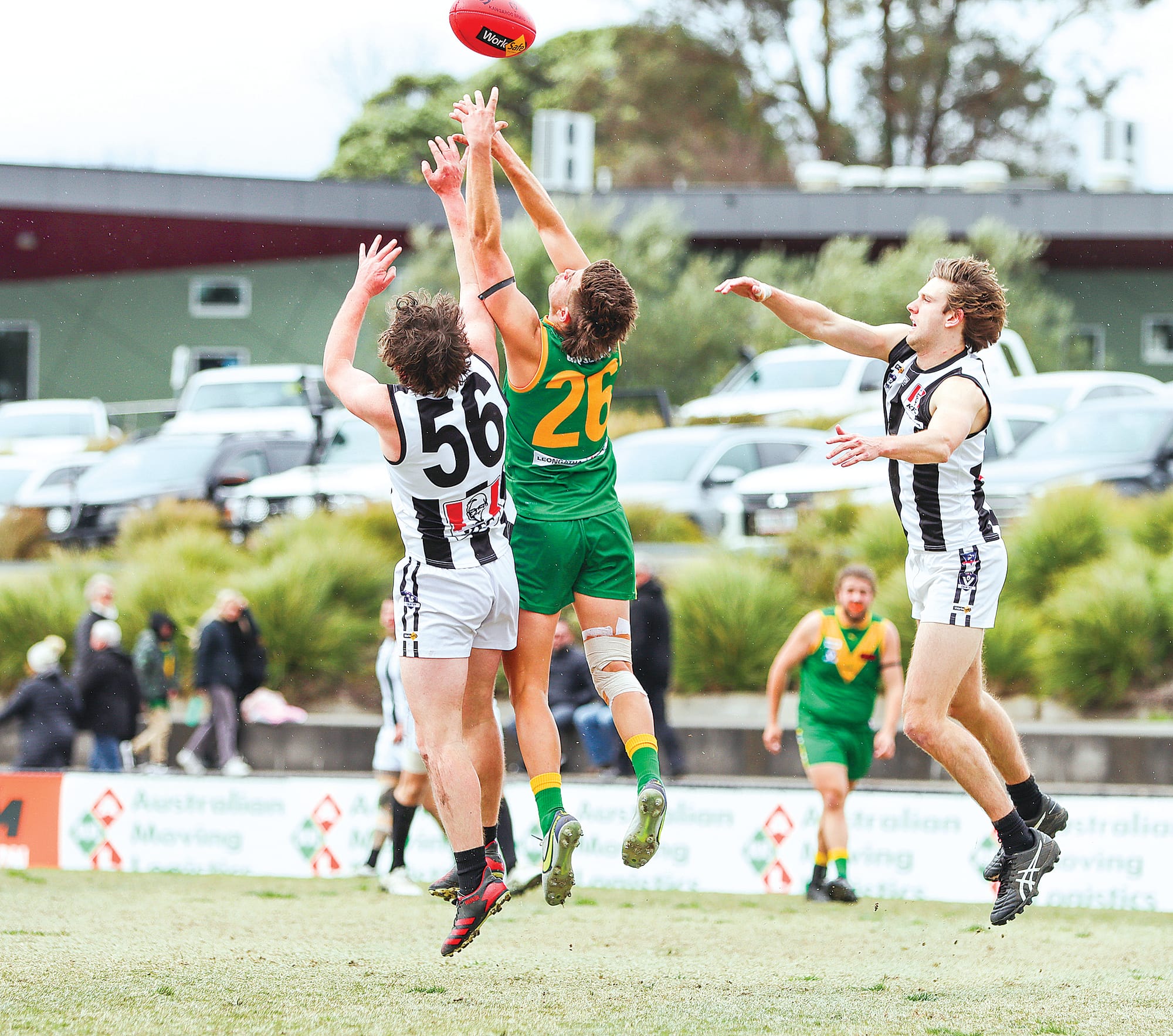 Parrot Jacob Lamers, one of Leongatha’s best, competes in the air against Thomas Campbell of Sale.