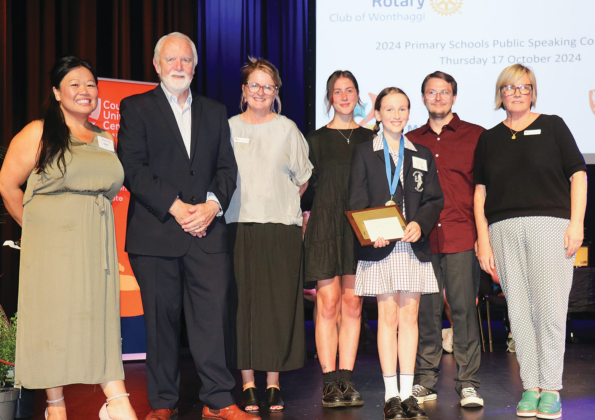 Nicki Chung, Don Paproth, Amanda Mc Mahon, Sophie Hogan, Alex Charlton, and Sarah Bourke presented the 2024 Primary Schools Public Speaking Competition second place prize to Sophia Hardy of Newhaven College. z25_4324 
