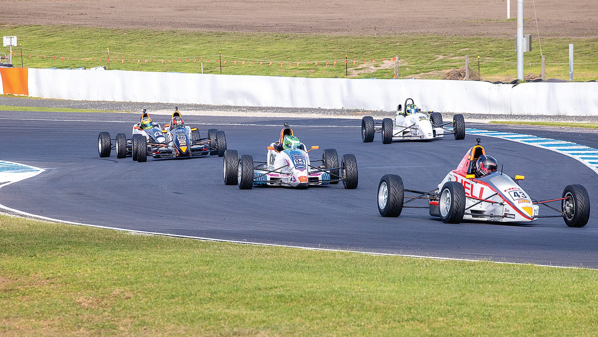 Formula Vee racing has always been a close-knit affair as the cars have similar horsepower outputs. Driver skill makes all the difference. Photo: Peter Cleeland.