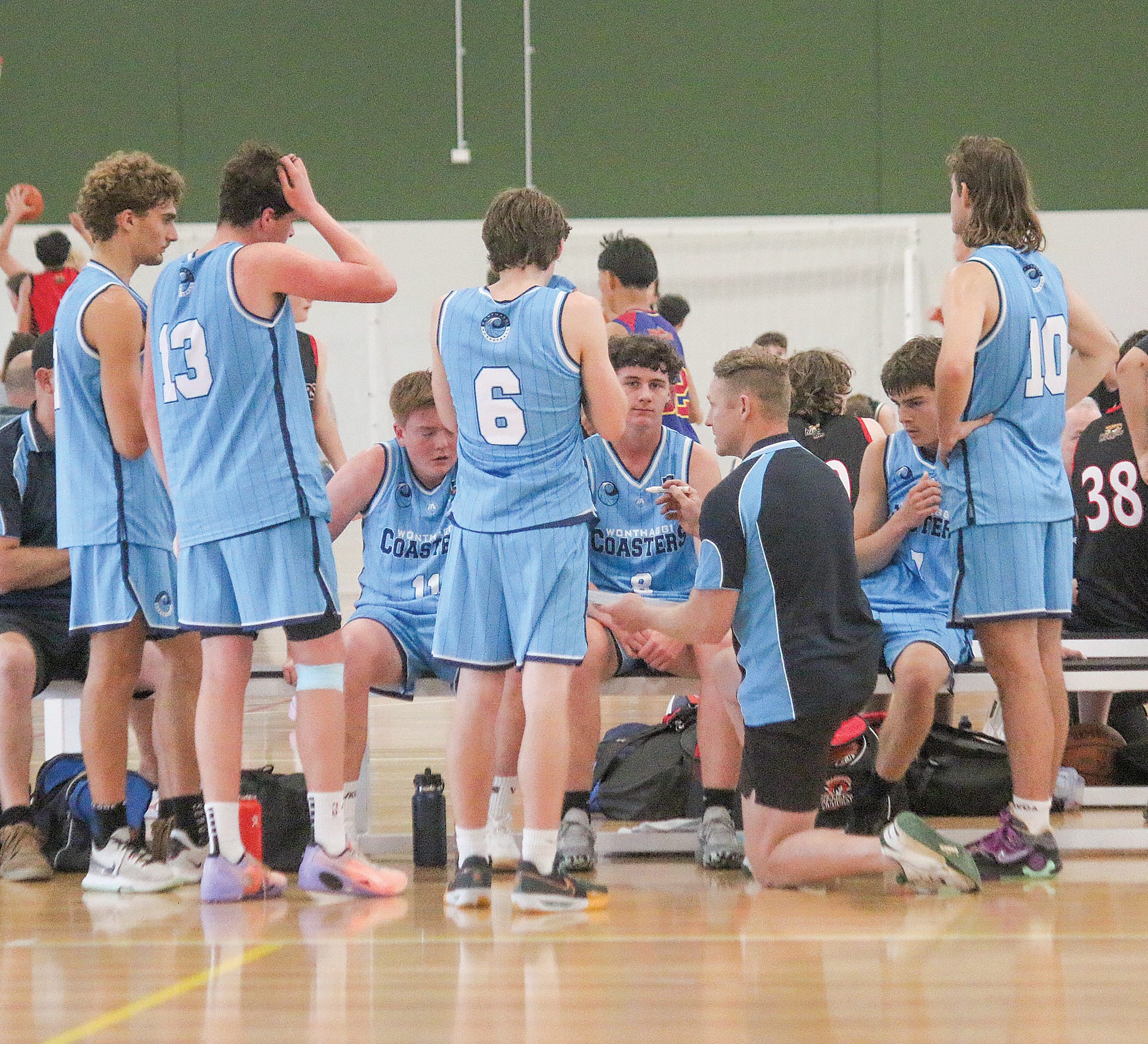 Under 19 Boys for Wonthaggi discuss strategy against Maffra at half time. ob70_4324