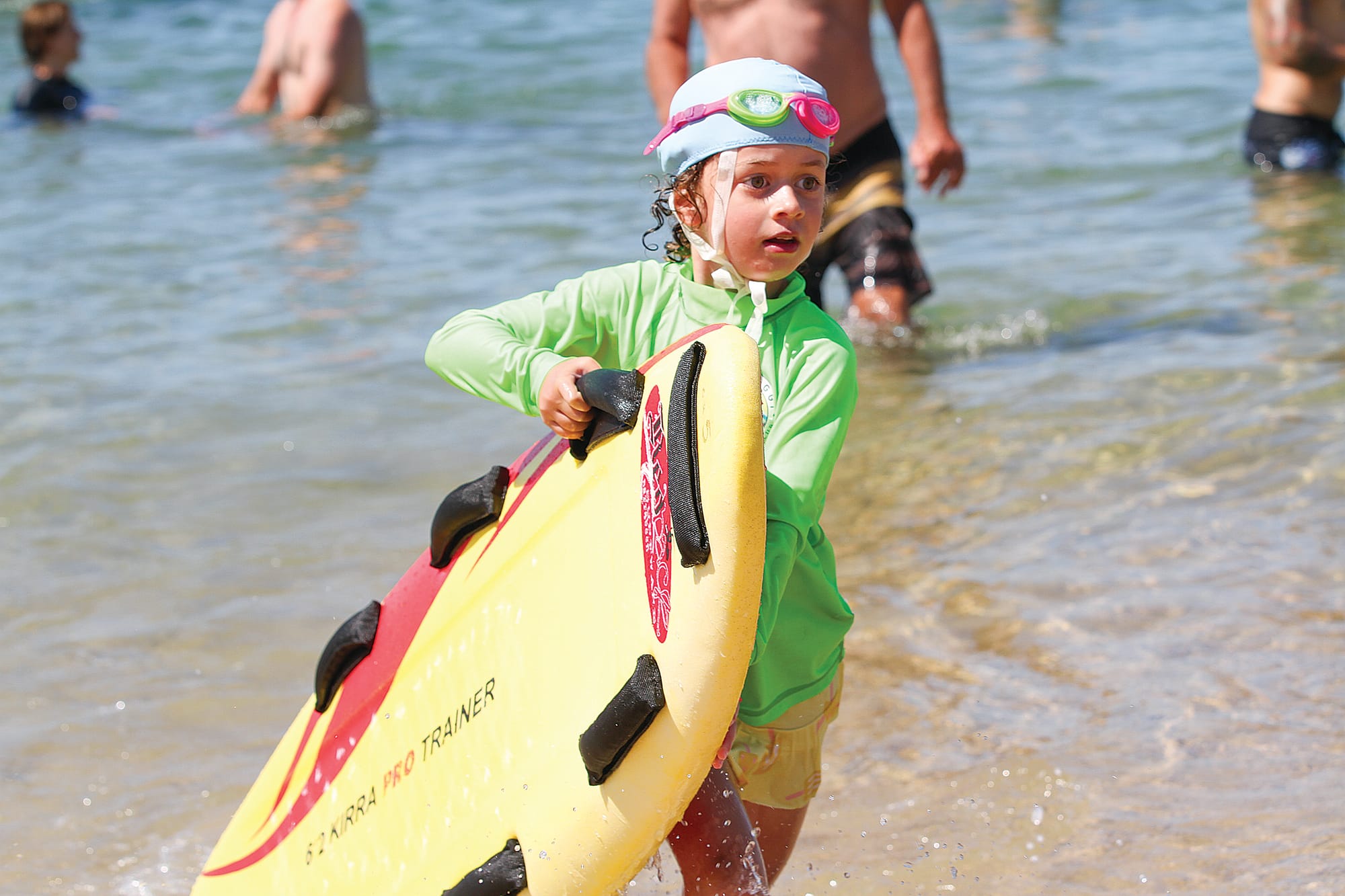 Wonthaggi nippers competing with paddle boards at WLSC Nipper Championships.