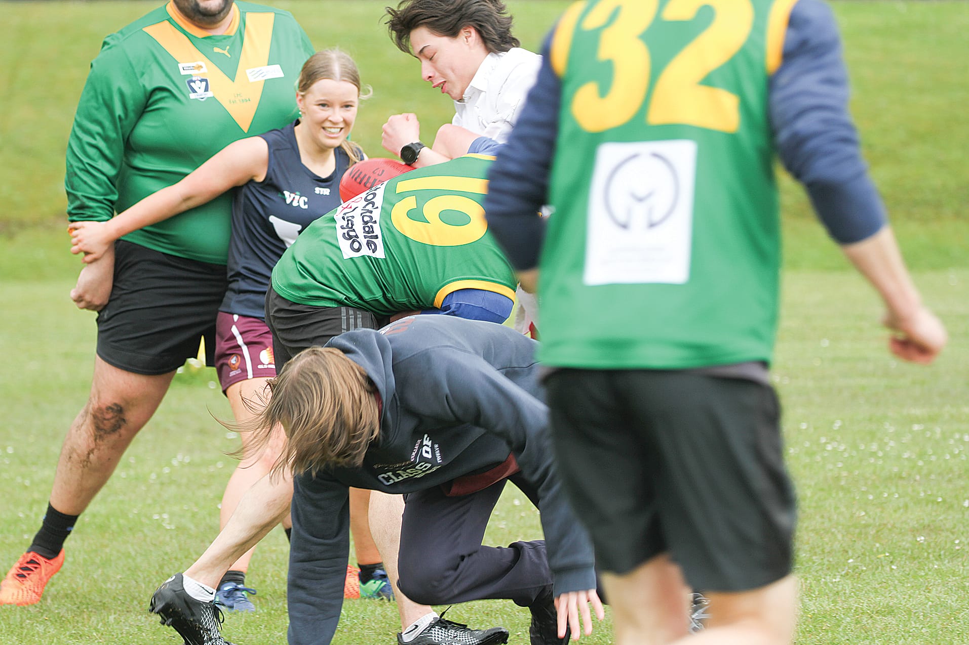 All hands on the ball for the annual Foster Secondary College teachers vs Year 12 students football match.
