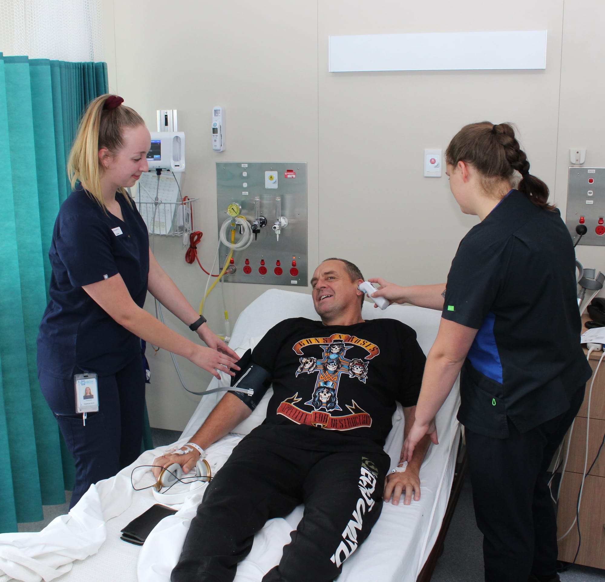 Registered Nurse Cassie Anagnostou and Student Nurse Kaitlyn Payne perform observations with patient Trevor Hodge in Kodowlinun Acute Ward.