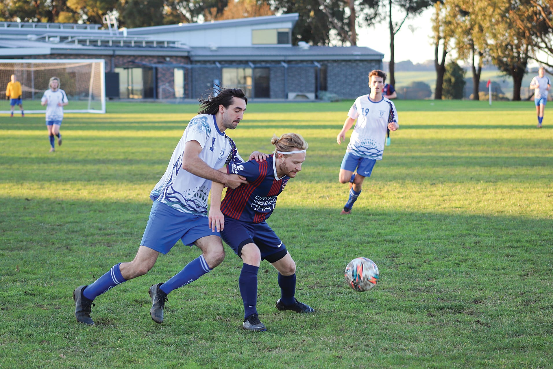Leongatha winger Mitch Bath pressures his Korumburra opponent.
