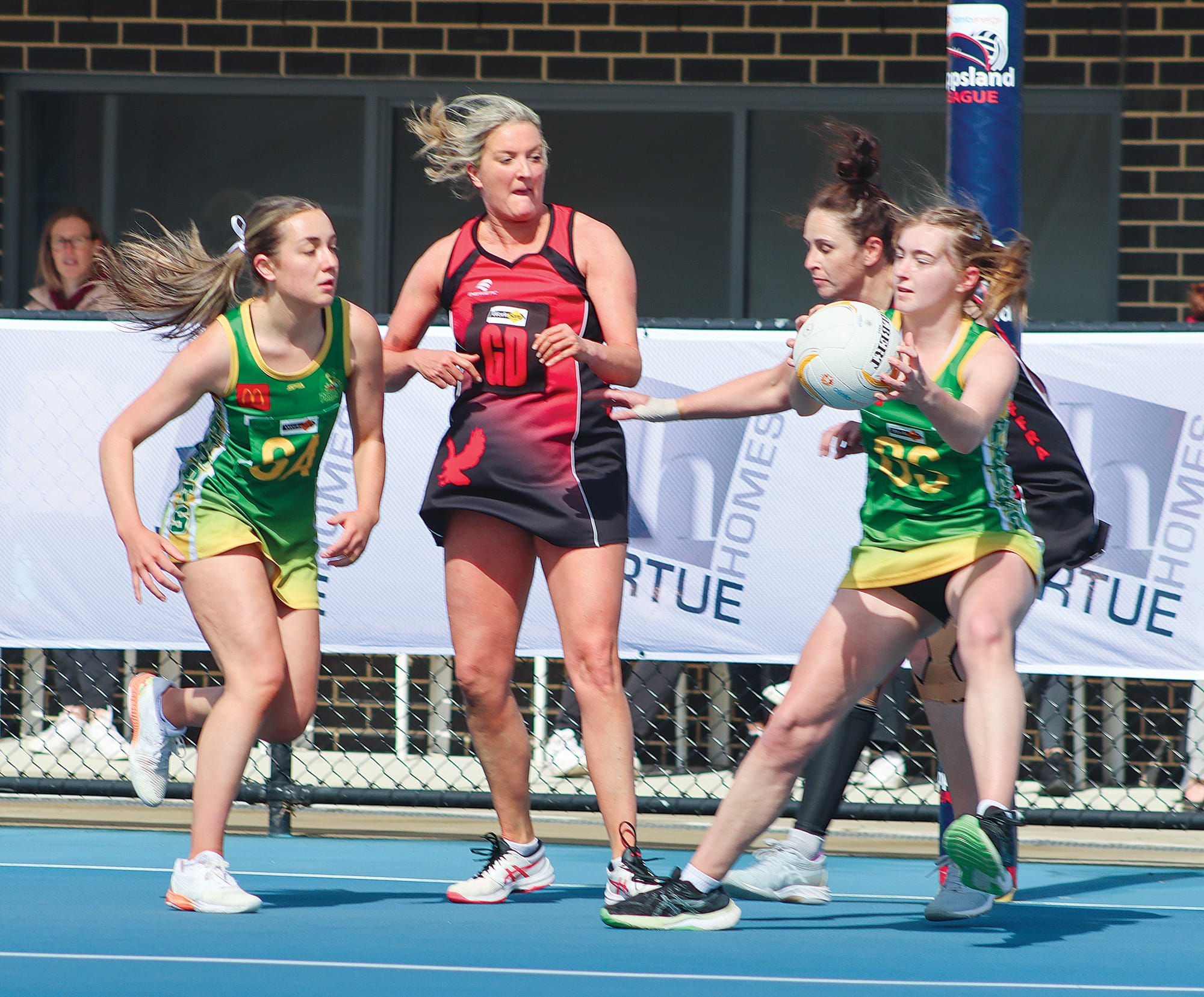 Lily Hume gets hold of the ball for Leongatha during its C Grade loss to Maffra. A25-3723
