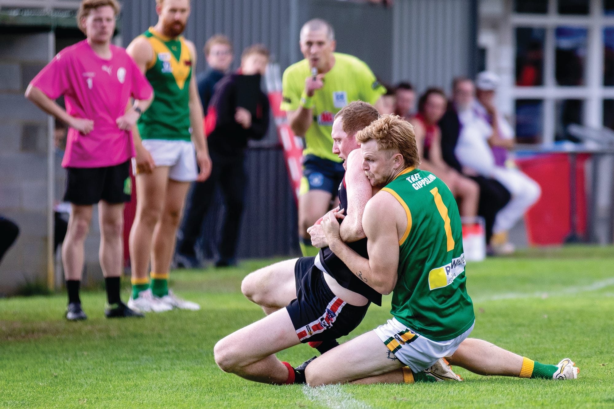Guy Dickson wrestles for the ball.