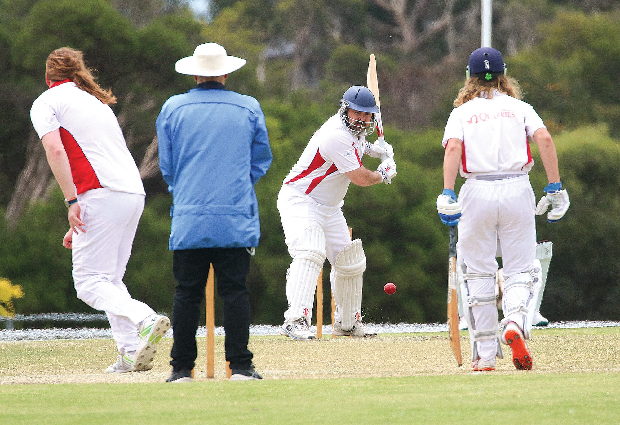 Nerrena’s Scott Checkley battles a low delivery from Glen Alvie captain Stephen Kennedy. 