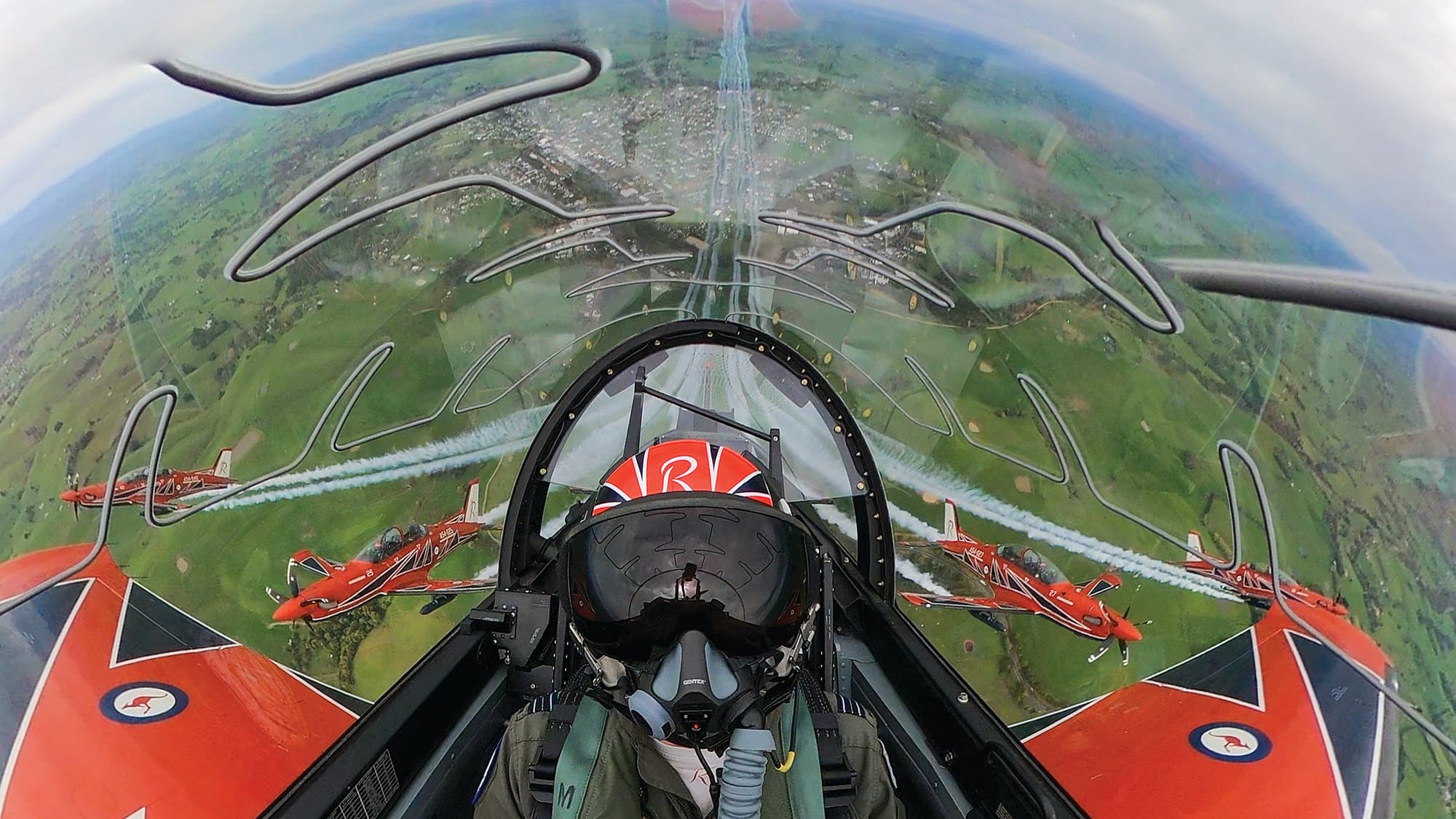 Residents look on from the ground below as the Roulettes perform an eagle pull-up.