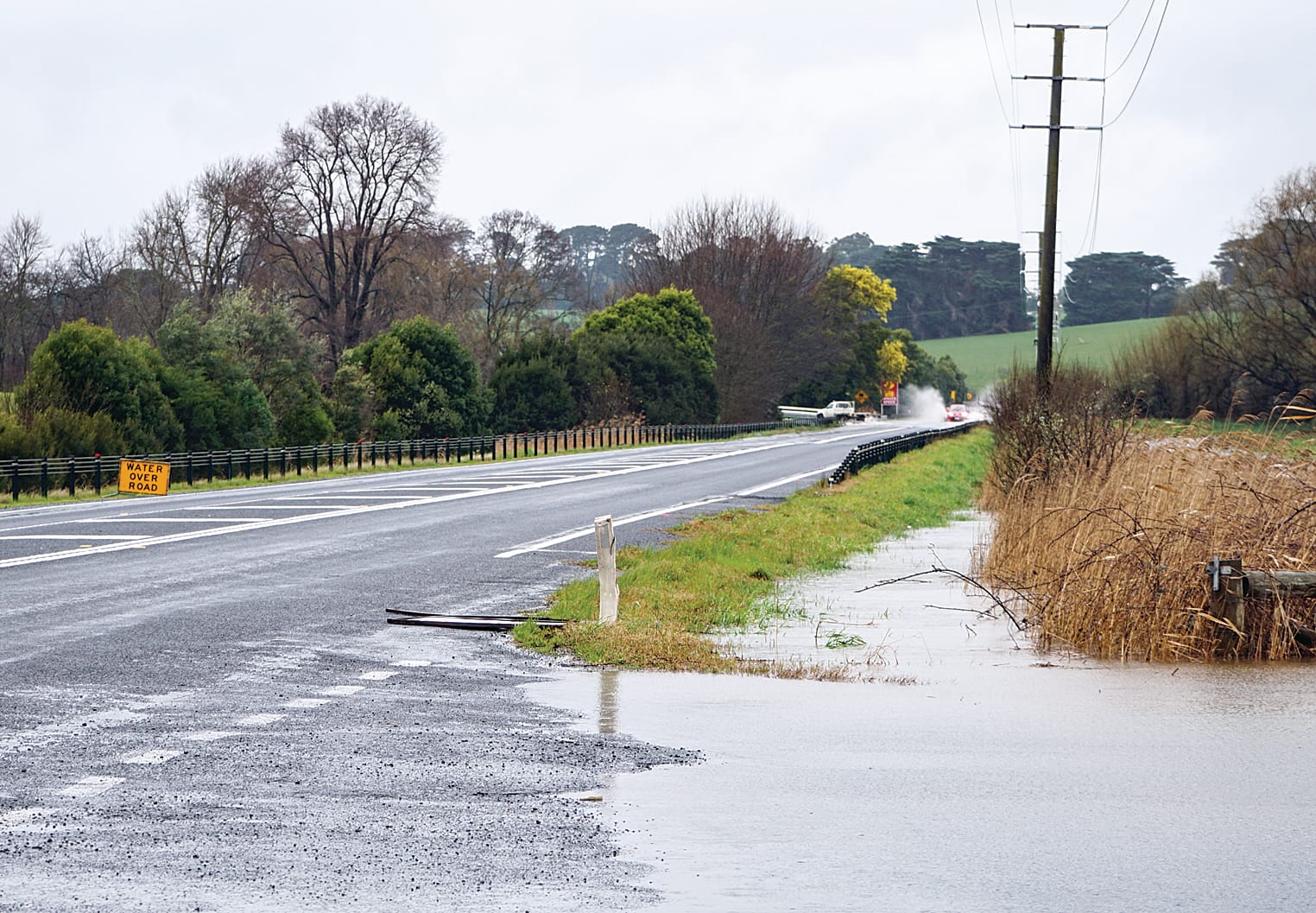 Floodwaters across Strzelecki Highway on Monday – deeper waters meant southbound traffic had to veer onto the right-hand side of the road. C43_3322