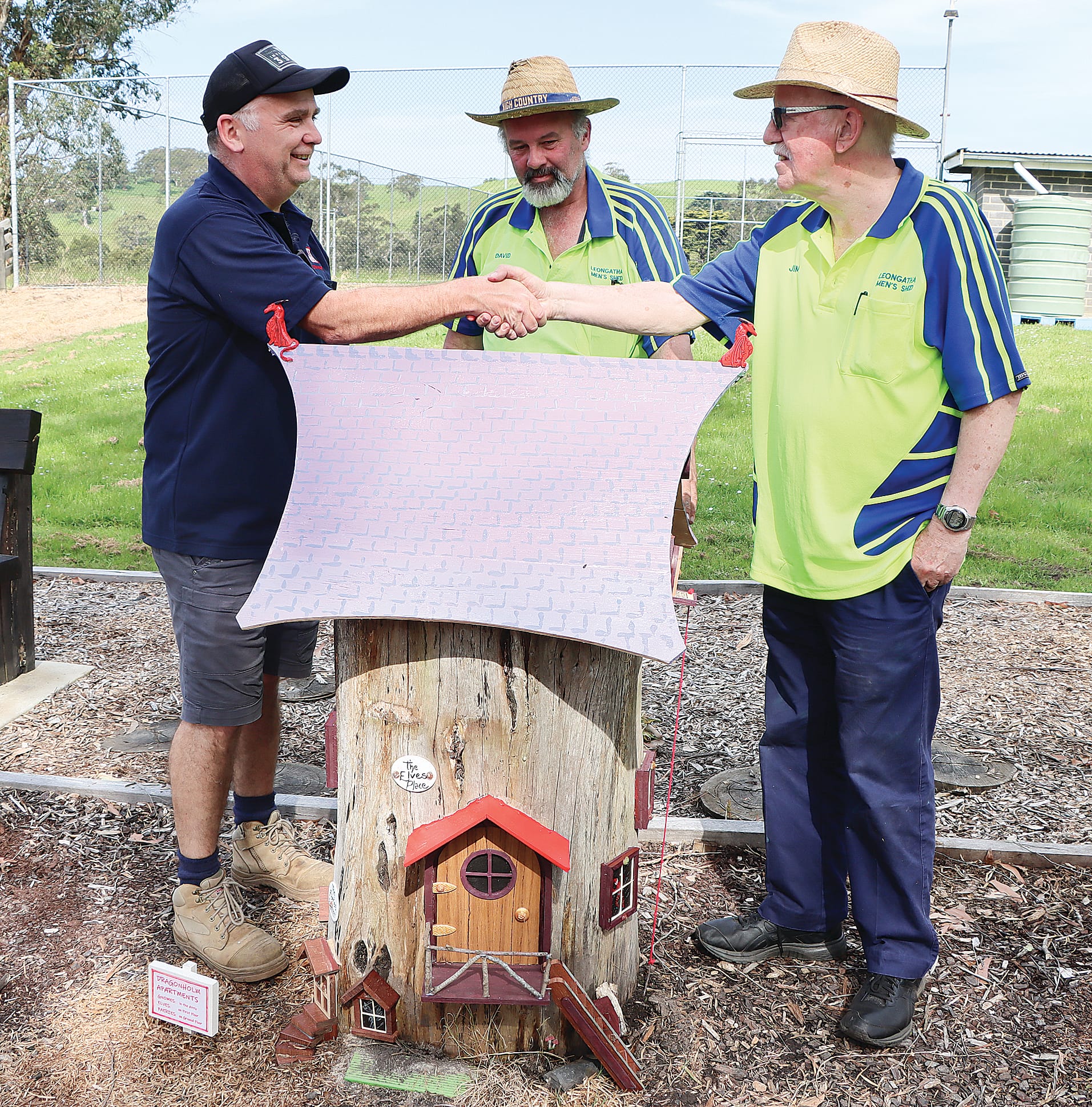 Former Koonwarra Recreation Reserve committee member Andrew Brick is delighted with the creativity of Jim Hendry of Leongatha Men’s Shed, with the Shed’s David Brereton looking on. A10_4323