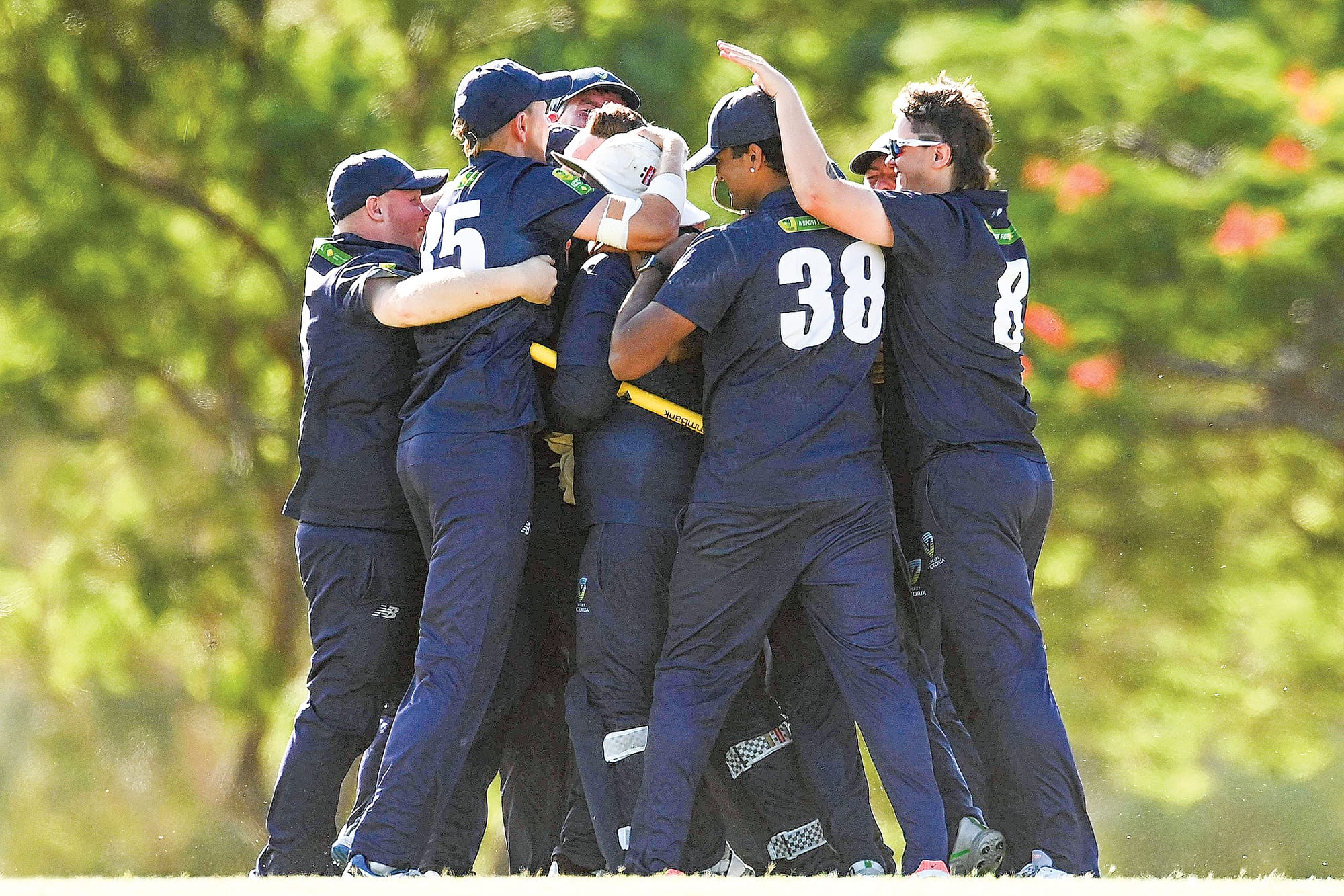 The Victorians come together to enjoy the moment after defeating Queensland in the Grand Final. 
