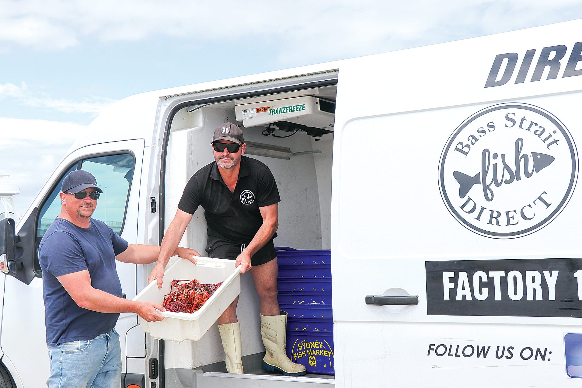 Owner of Bass Strait Direct Curt Trewavis picks up fresh 10–15-year-old crays from local cray fisherman Matthew Harry, delivered straight off the boat at the San Remo jetty. z01_5022