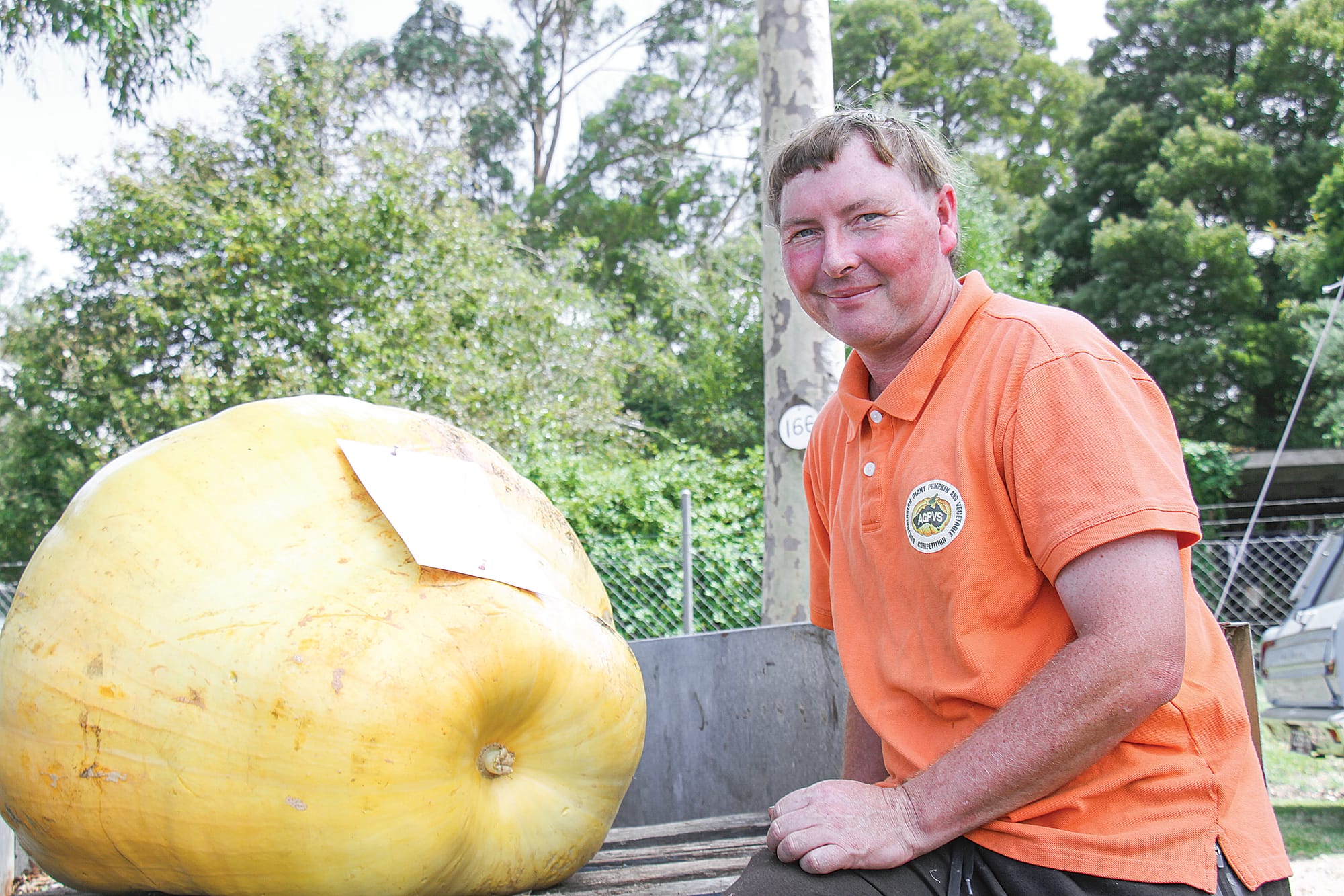 Phillip MacCauley with a whopping 153kg Atlantic Giant pumpkin. B67_0825
