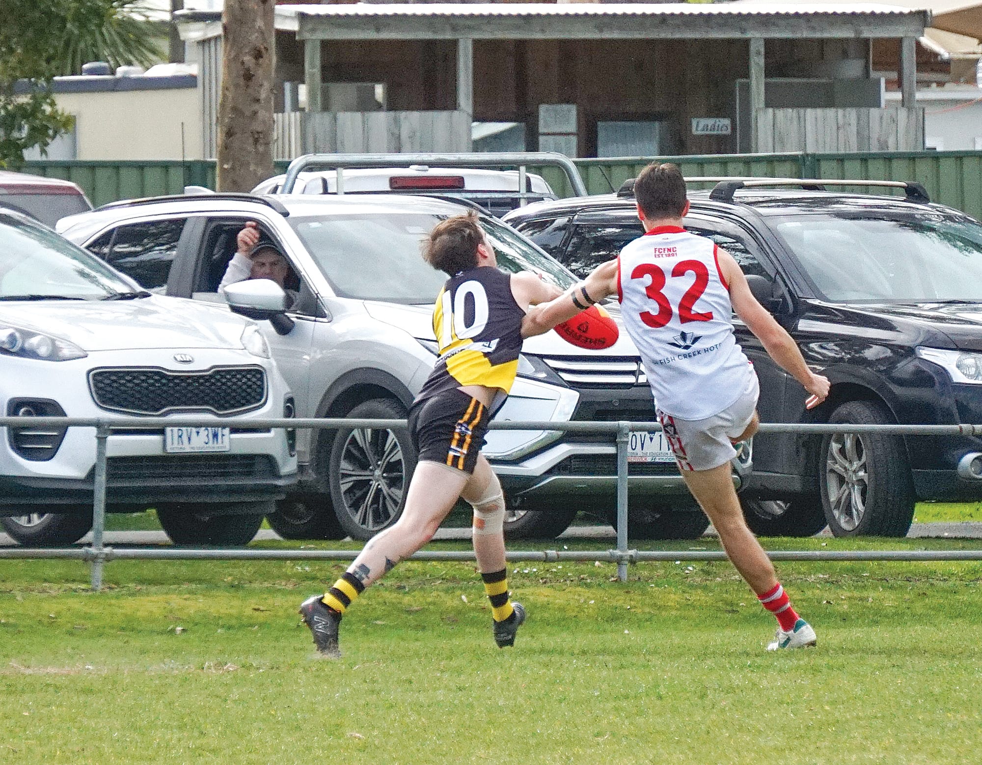 Blaine Coates scores despite the pressure from his Foster opponent Brock Cripps. ns19_3324