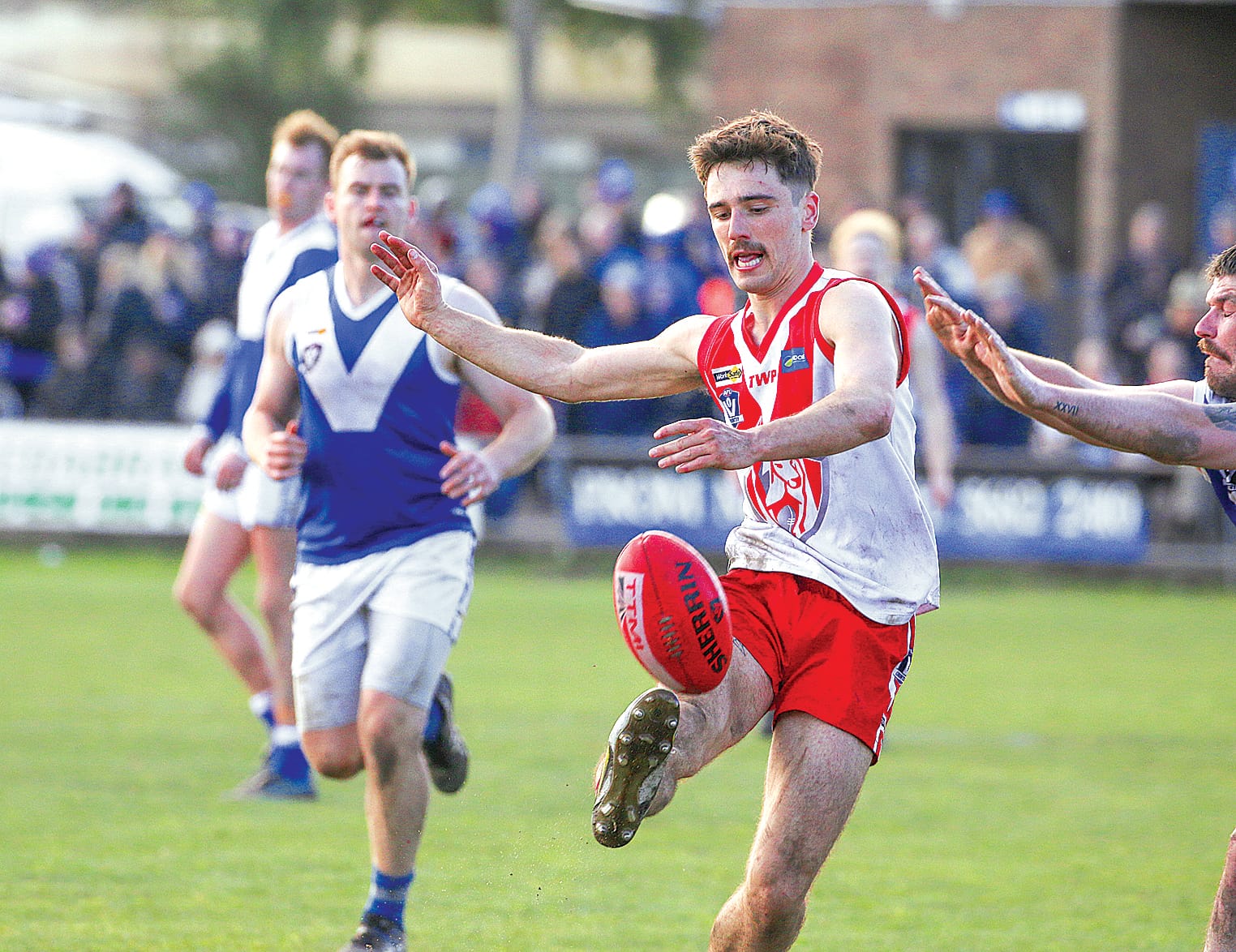 Sam McGannon booted the ball ahead of a Thorpdale tackle for Fish Creek.