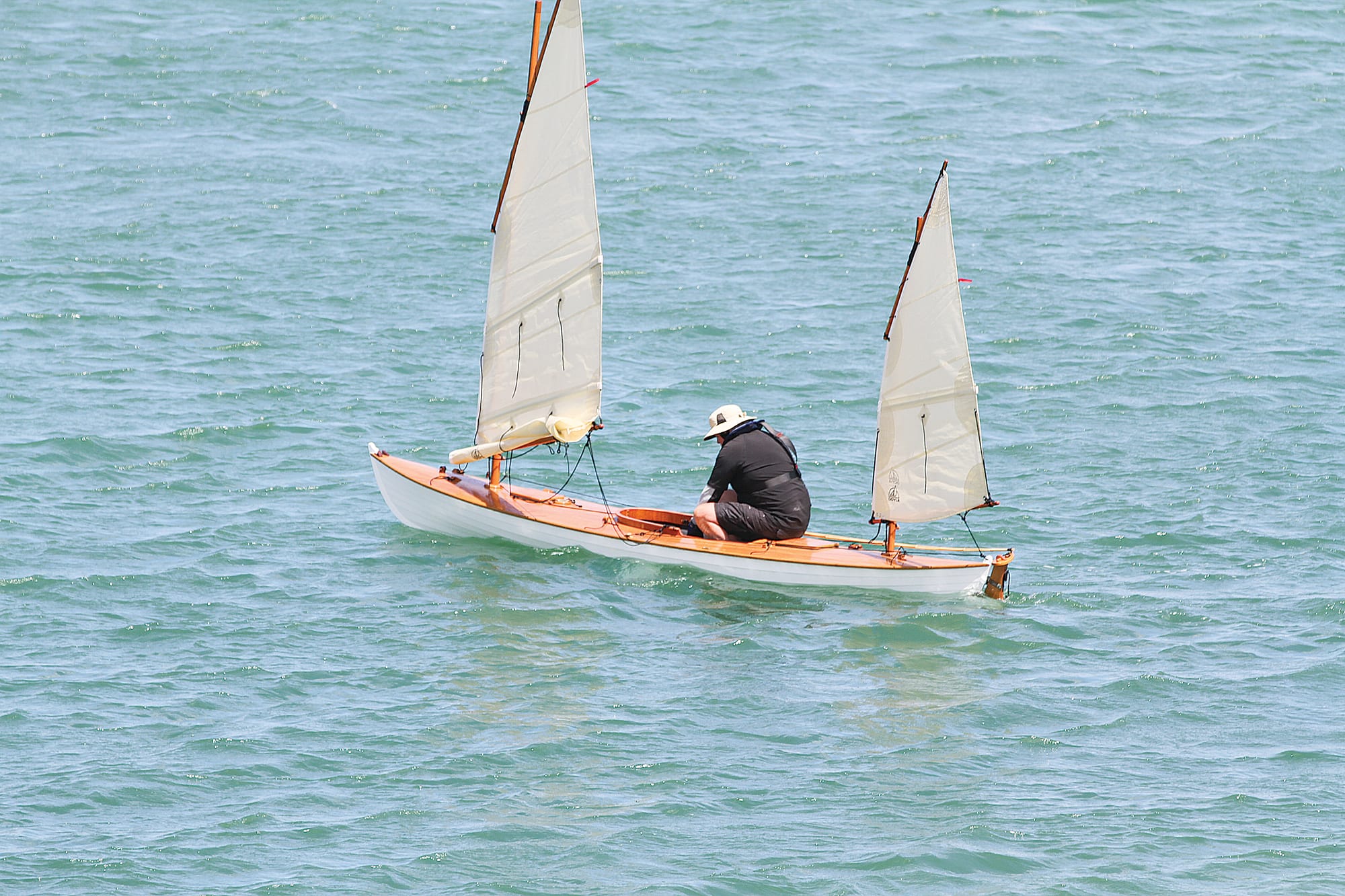 Robert McIntyre sailing a MacGregor Canoe in the Wooden Dinghy Classic at Inverloch B80_0725