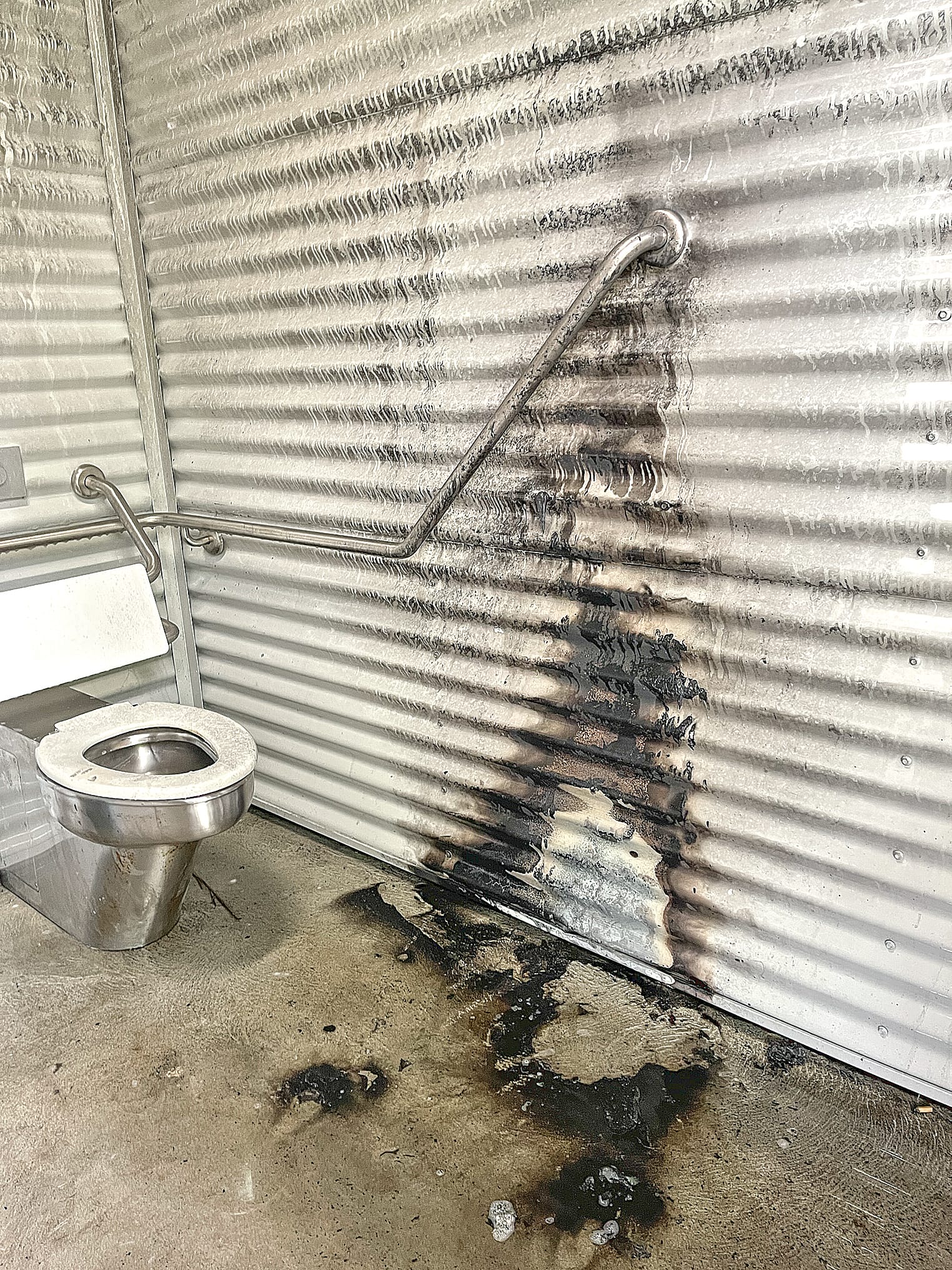 The toilet damaged by a deliberately lit fire in the toilet block at the Harold Hughes Reserve in the centre of Corinella. Photo: Meryl Tobin.