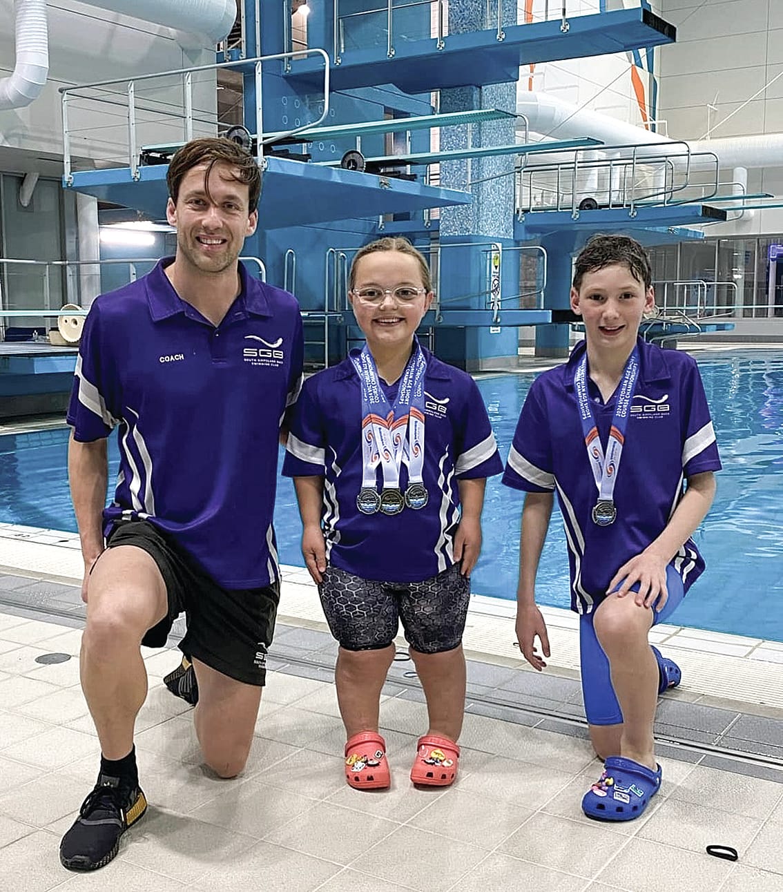 Coach Dylan congratulated Gemma and Levi on their achievements at the Melbourne Sports and Aquatic Centre.
