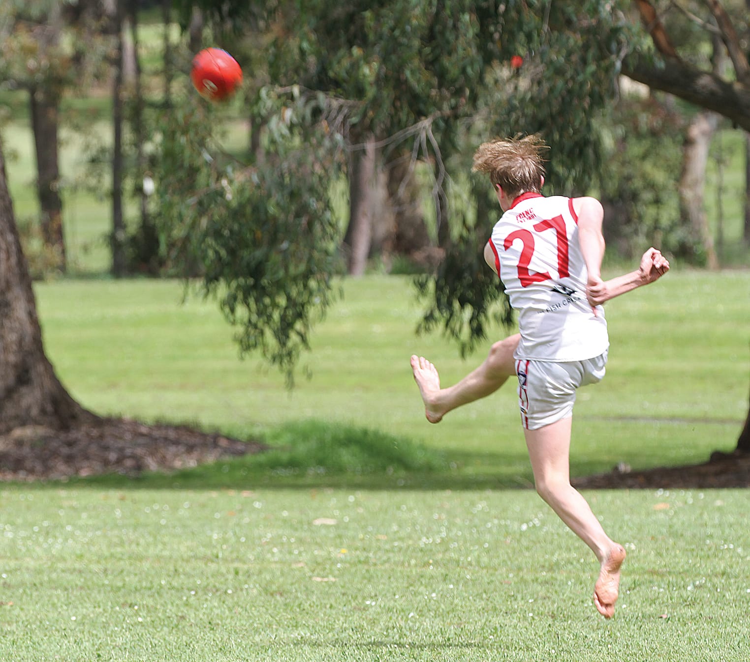 Year 12 Foster Secondary College student boots home a superb goal barefoot.
