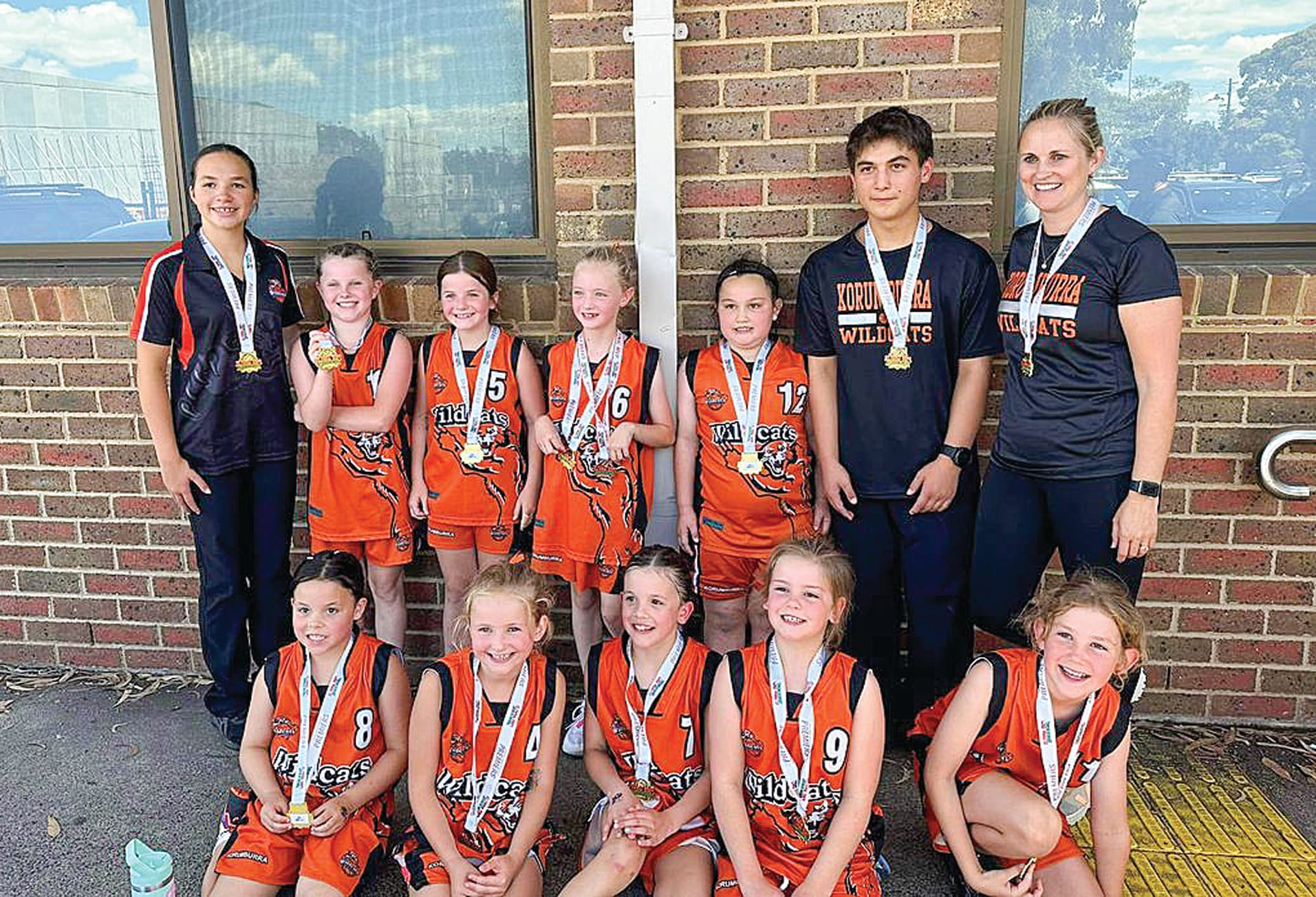 The Wildcat girls enjoy their Under 10 grand final triumph.