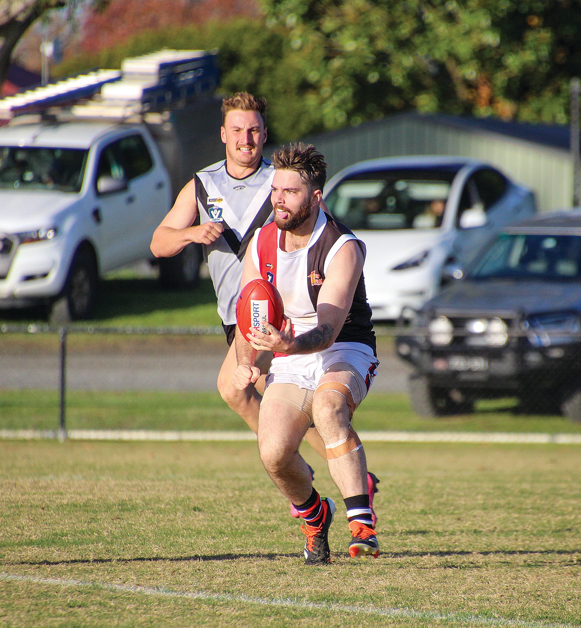 Dylan Heylen gets ready to pass the footy to a Nyora teammate.